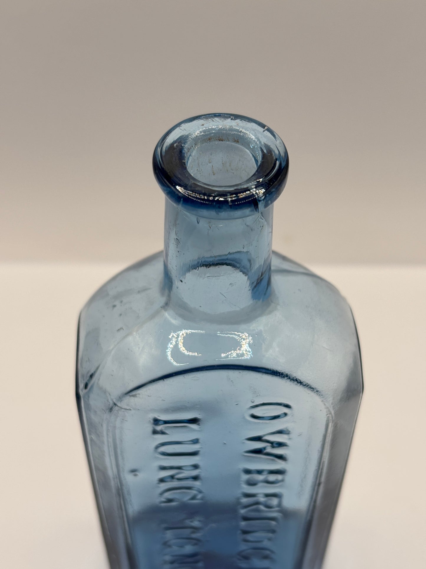 Old blue glass advertising chemist bottle, Owbridge Lung Tonic