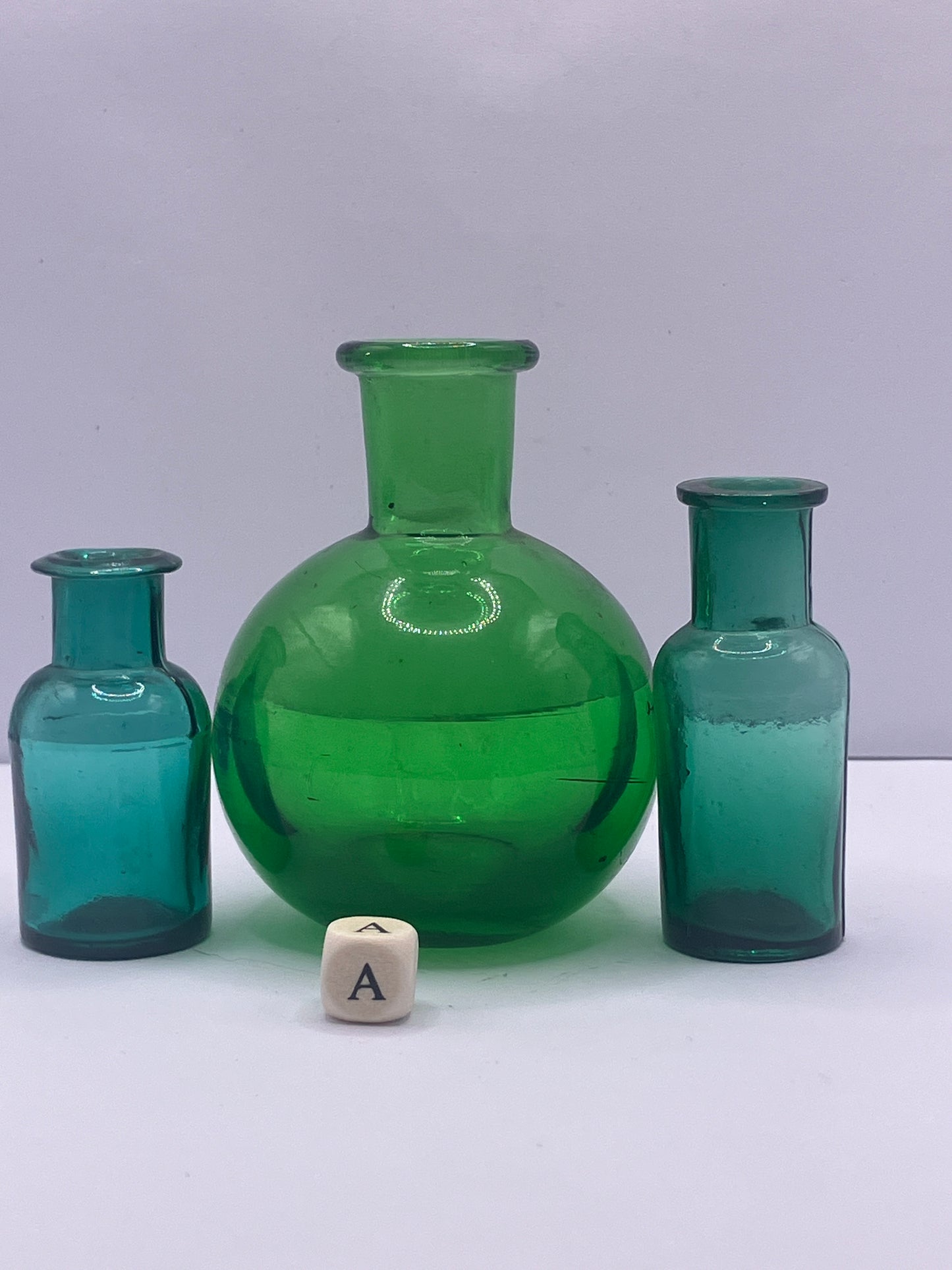 3 mini green glass bottles (a)