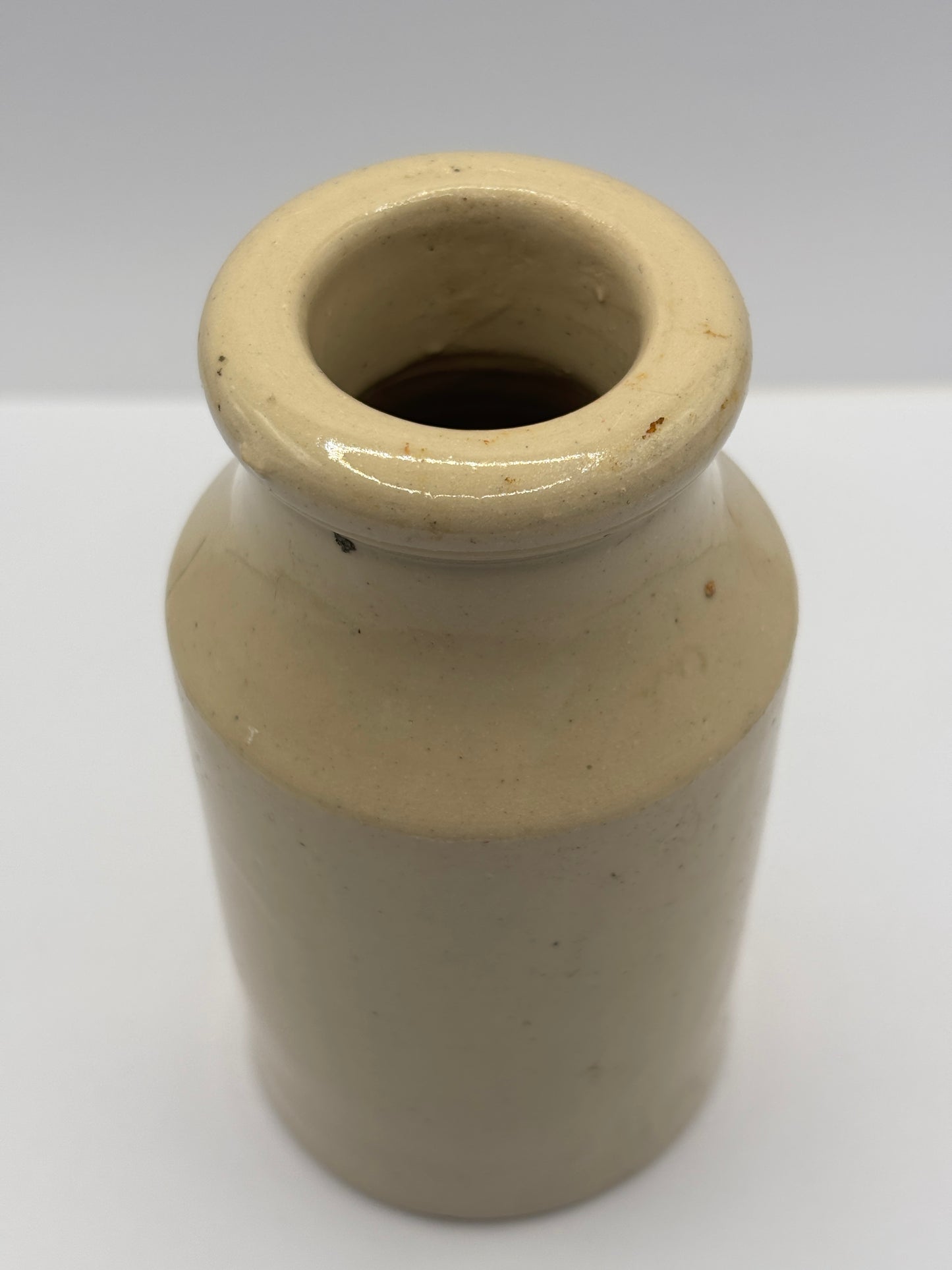 Old white stoneware jar, small vase