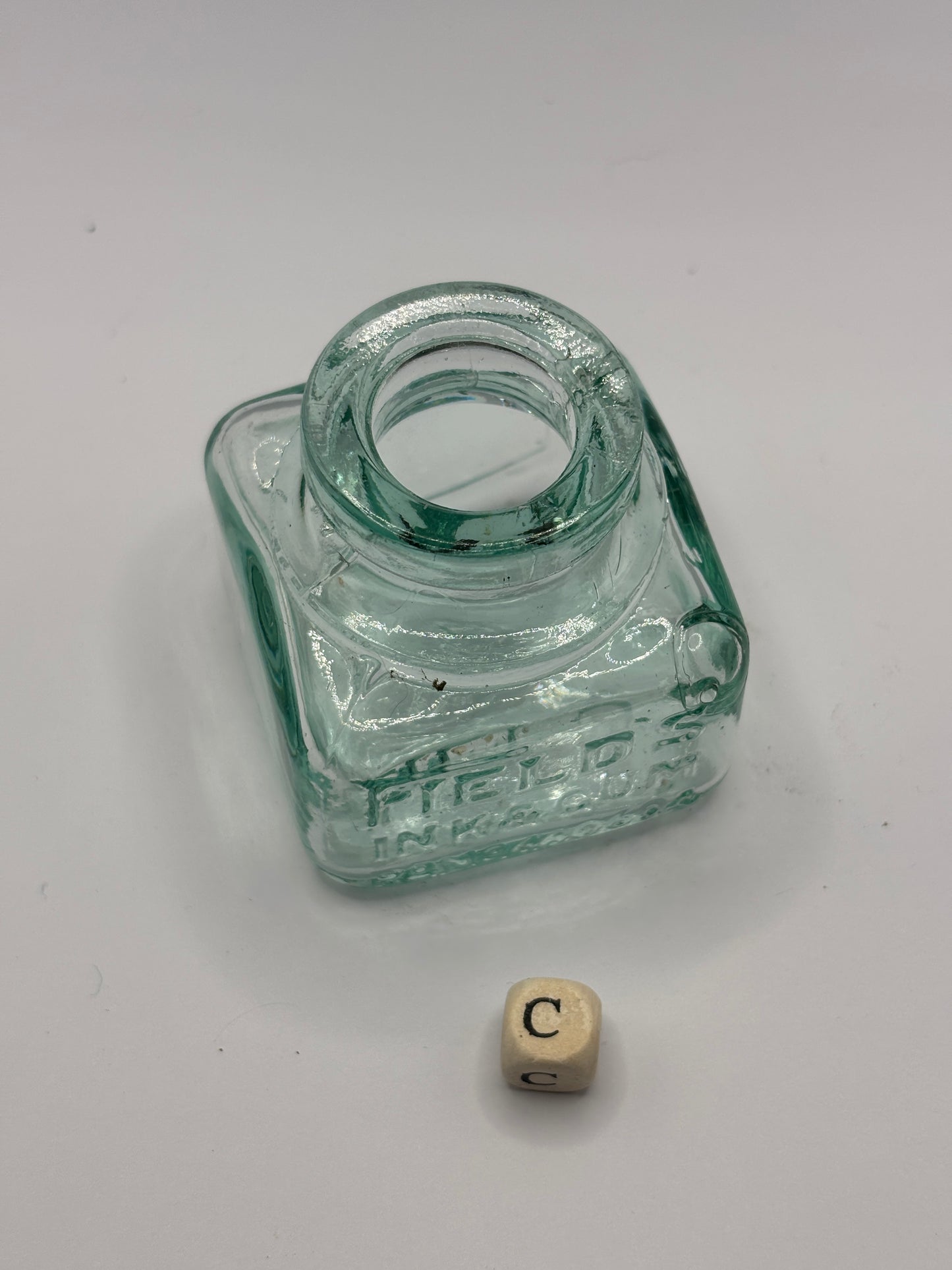 Old aqua glass ink bottle, inkwell. fields ink & gum (C)