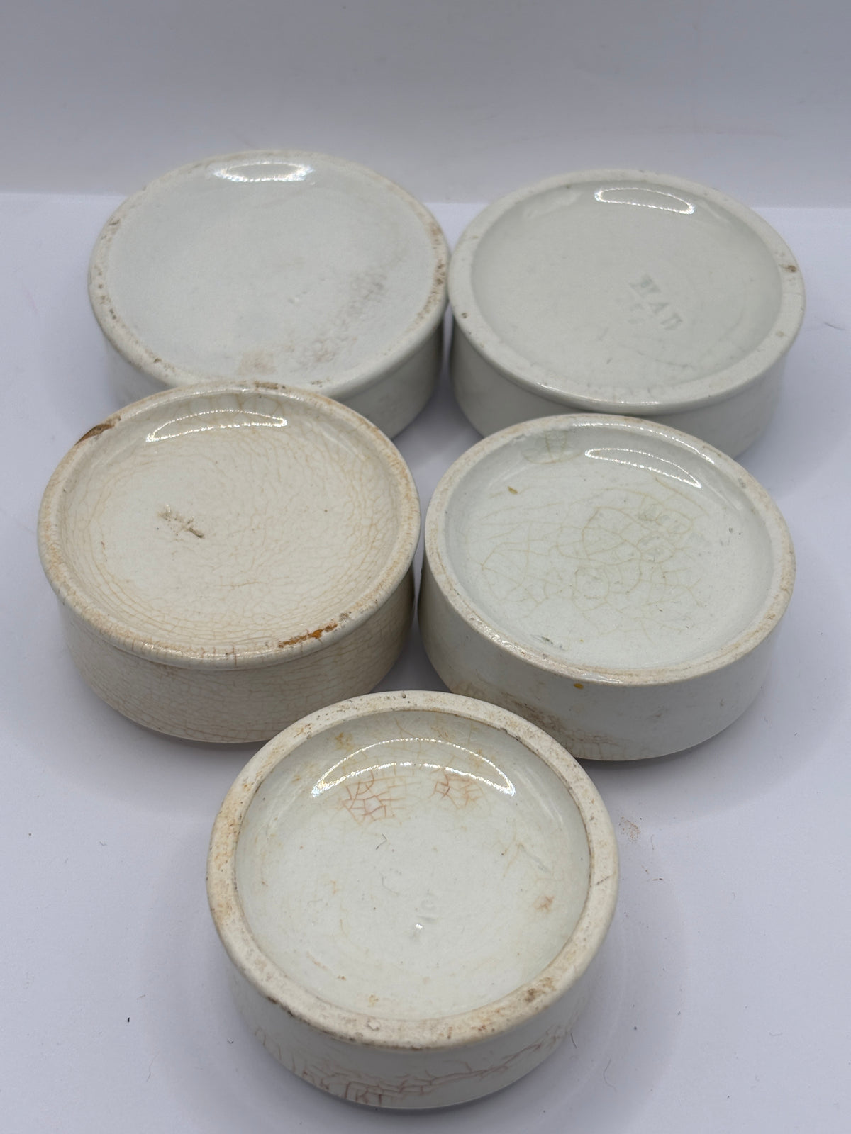 5 old stoneware pot lid bases, stackers (e)