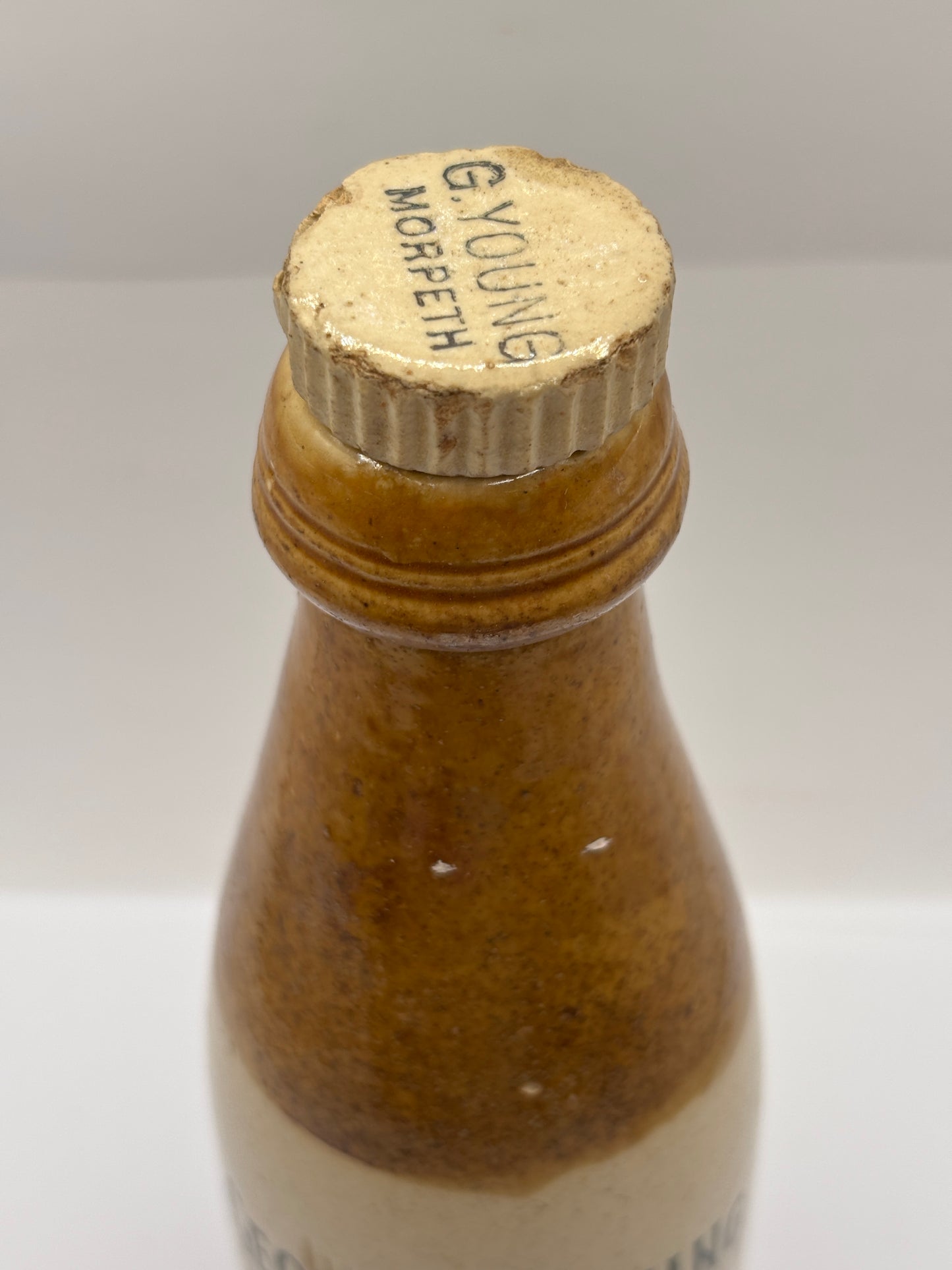 Old stoneware ginger beer bottle, George Young. Morpeth brewed ginger beer. Original stopper