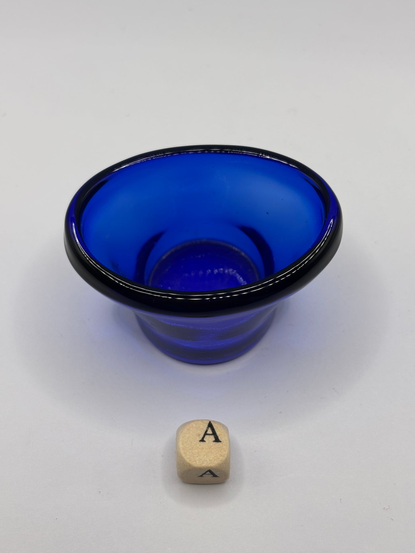 Old blue glass eye bath (a)