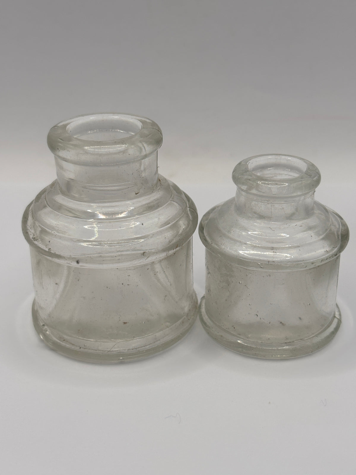2 old clear glass inkwells, ink bottles