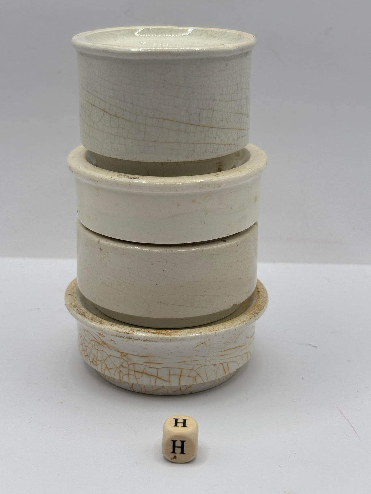4 old stoneware pot lid bases, stackers (H)