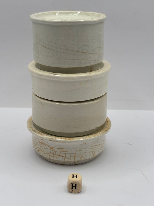 4 old stoneware pot lid bases, stackers (H)