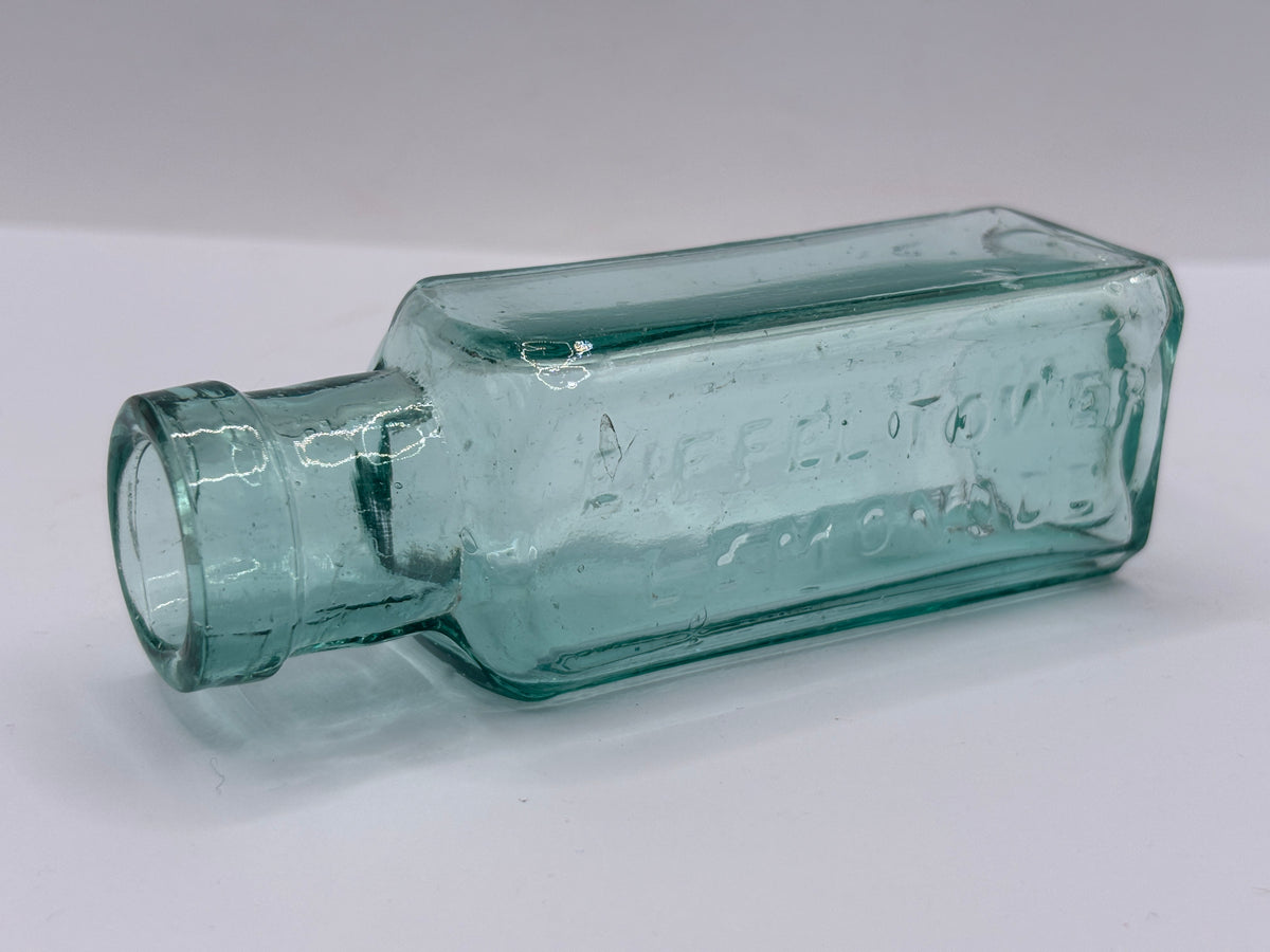 Old aqua glass advertising bottle, Eiffel tower Lemonade