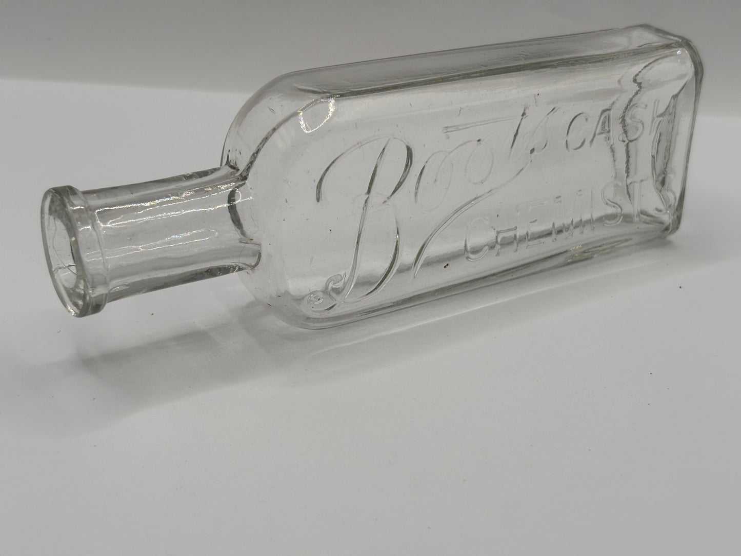 Old clear glass Boots cash chemists bottle