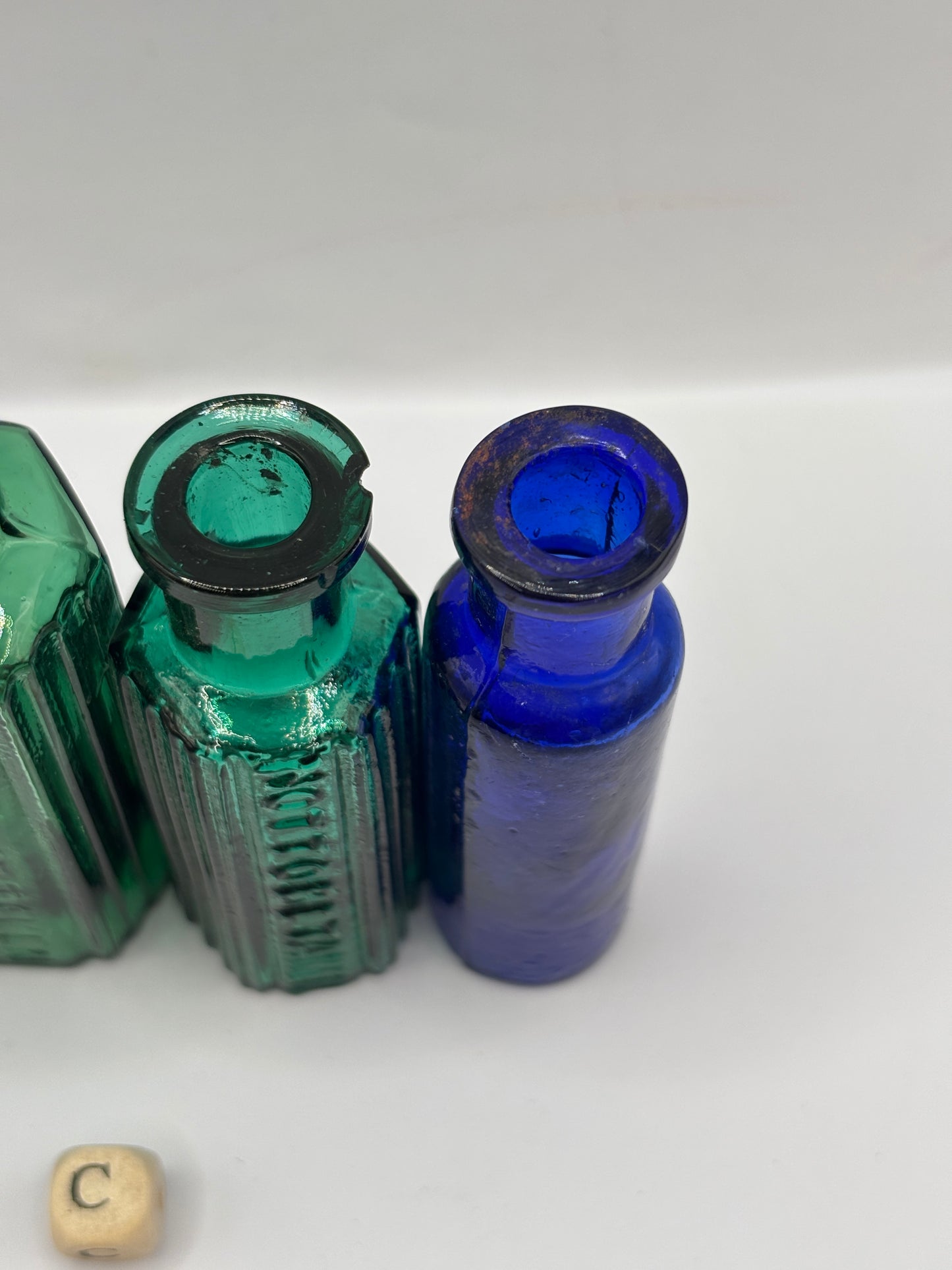 4 old glass poison bottles, chipped (C)