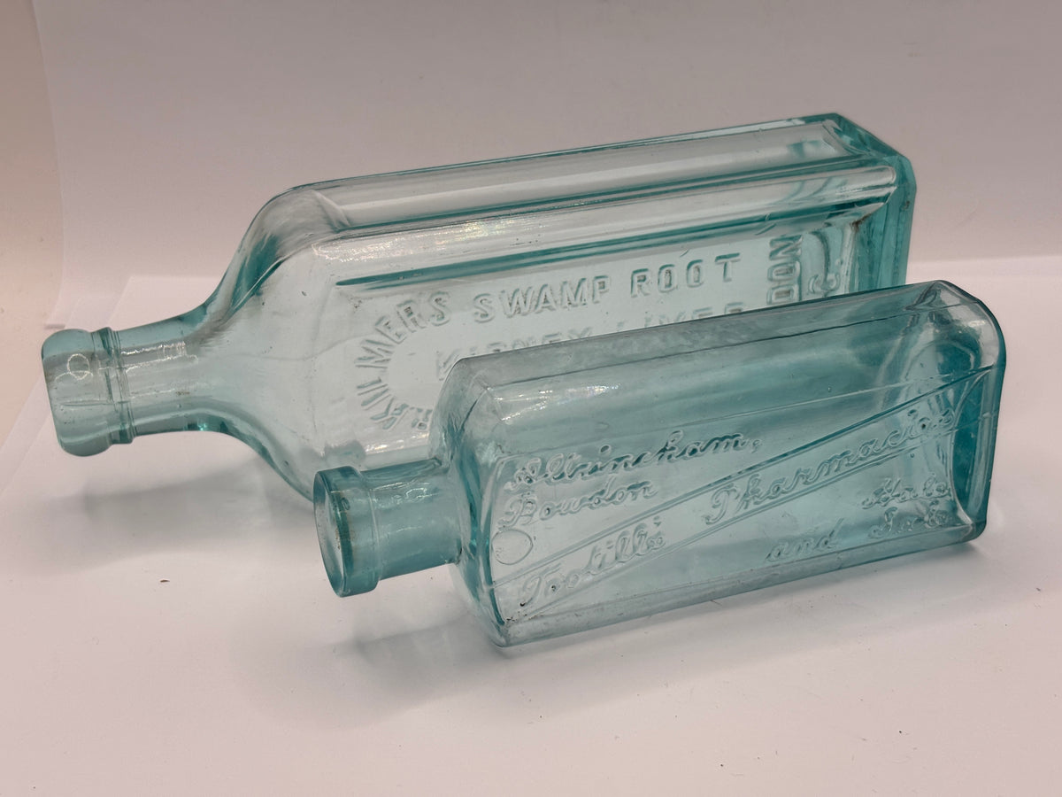 2 old  advertising chemist bottles