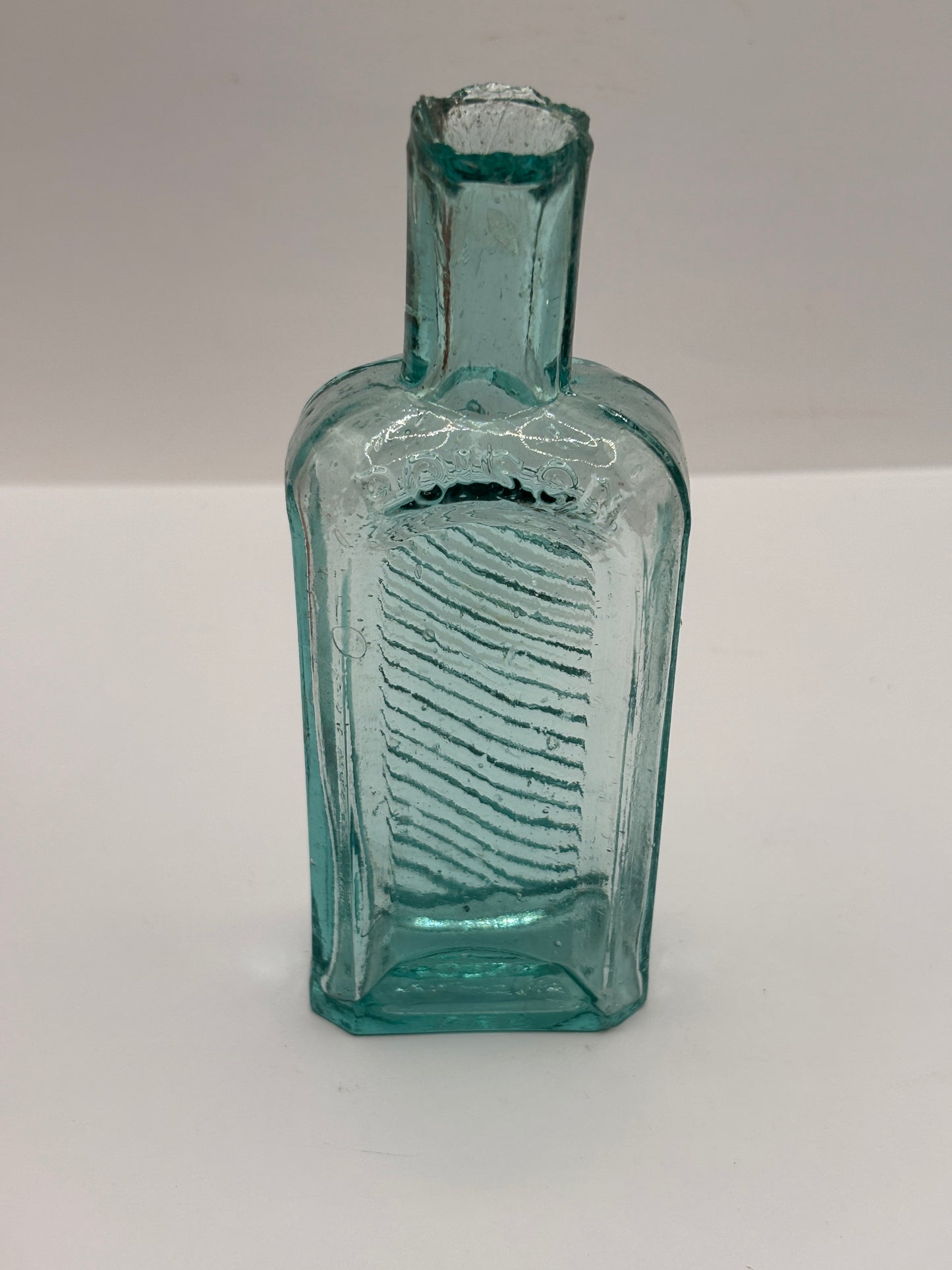 Old aqua glass poison bottle, not to be taken