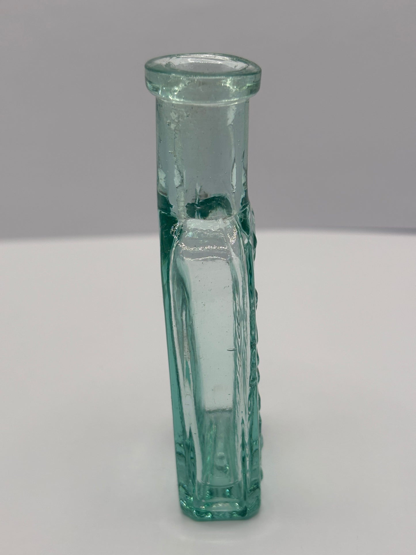 Old aqua glass advertising chemist bottle. Pritchards teething powder