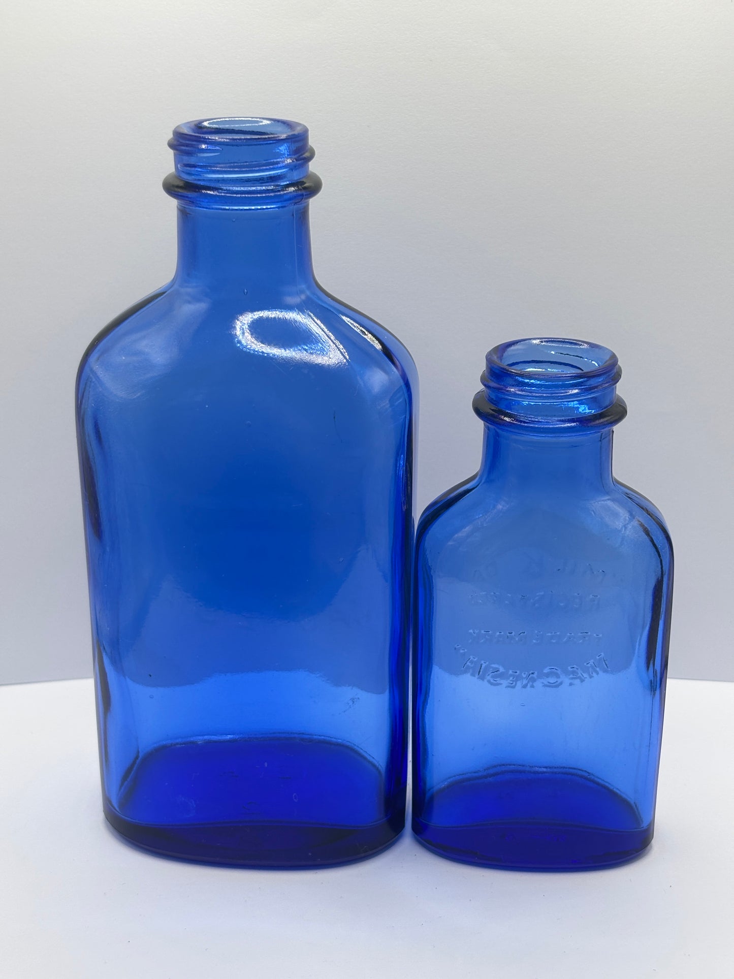 2 vintage Blue milk of magnesia bottles