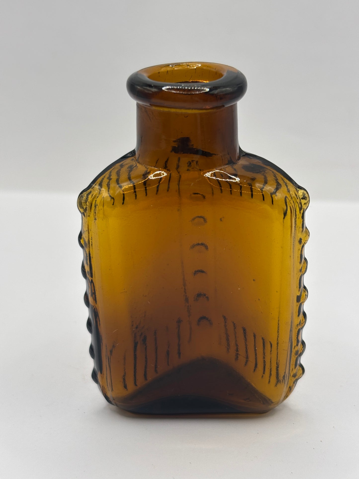 Old amber glass poison bottle