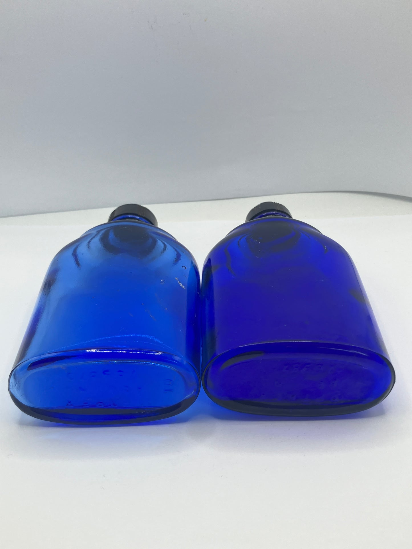 2 blue glass optrex bottles