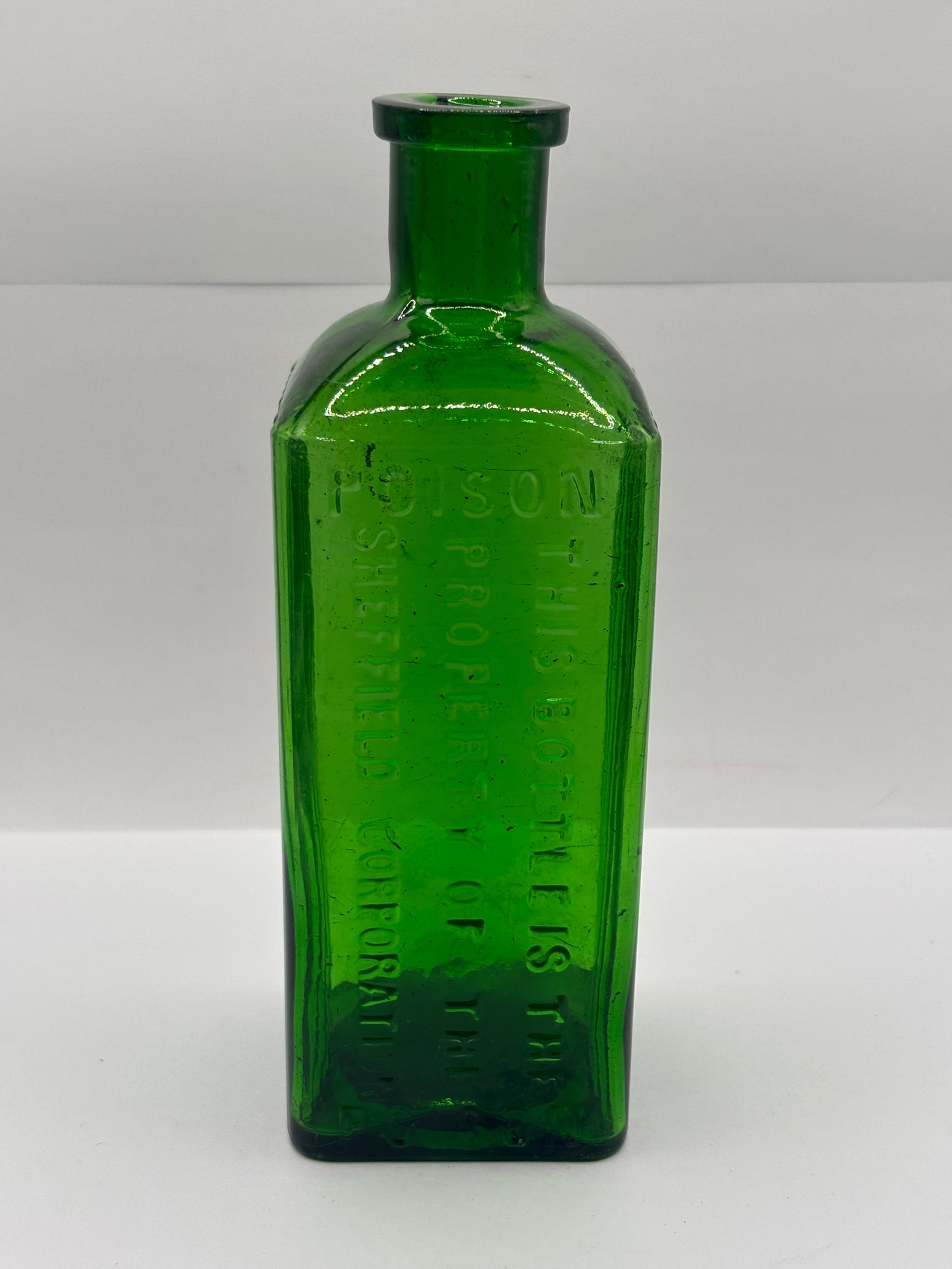 Old green glass poison bottle, Sheffield corporation poison bottle. Chipped
