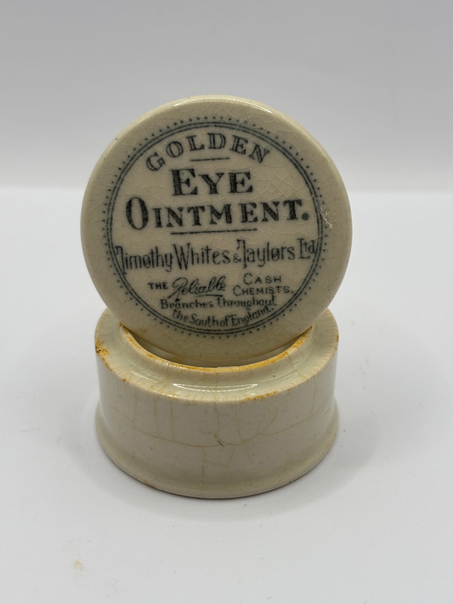 Old advertising lid and base, Timothy Whites Golden eye ointment