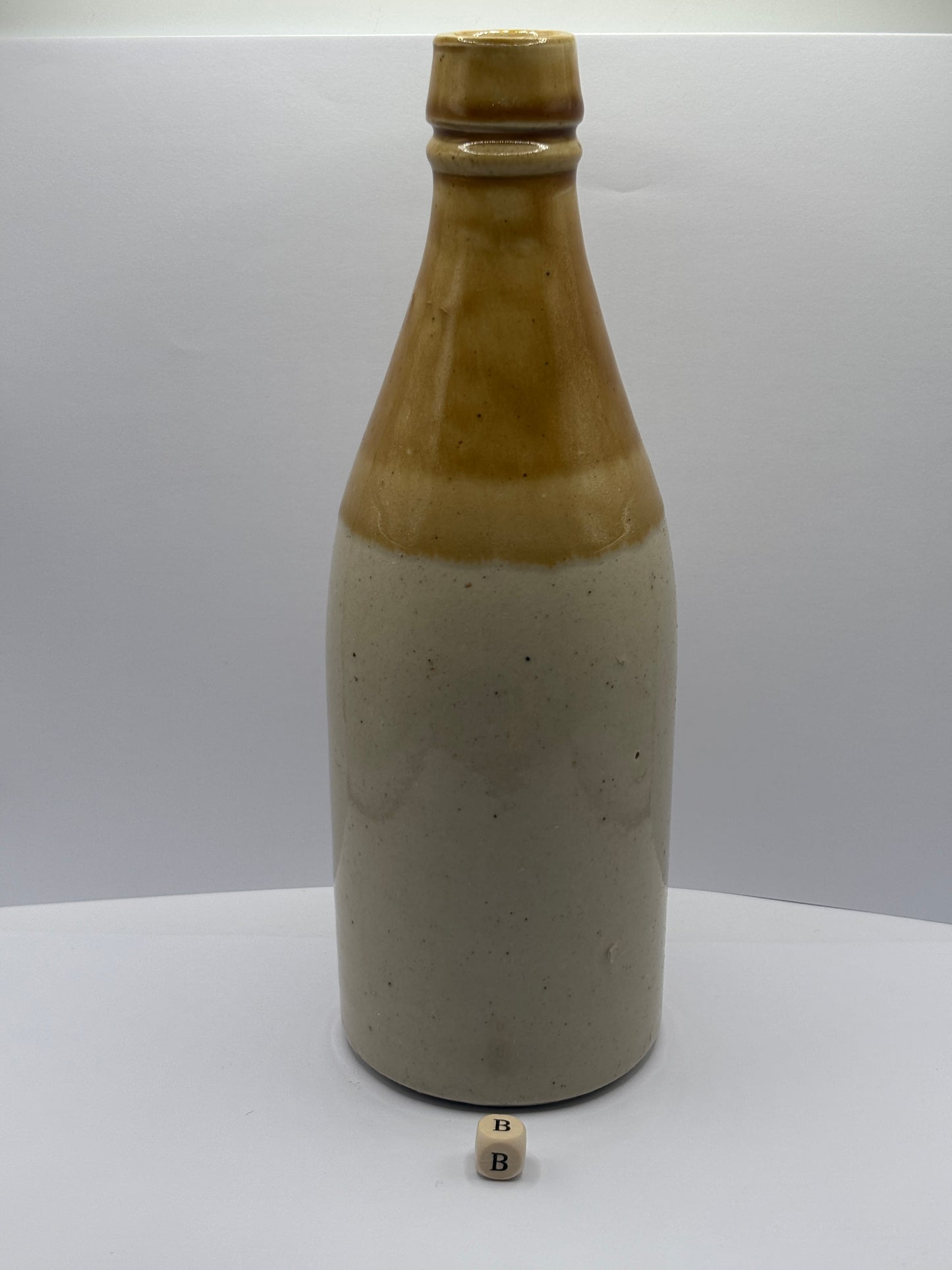 Old plain stoneware ginger beer bottle (B)