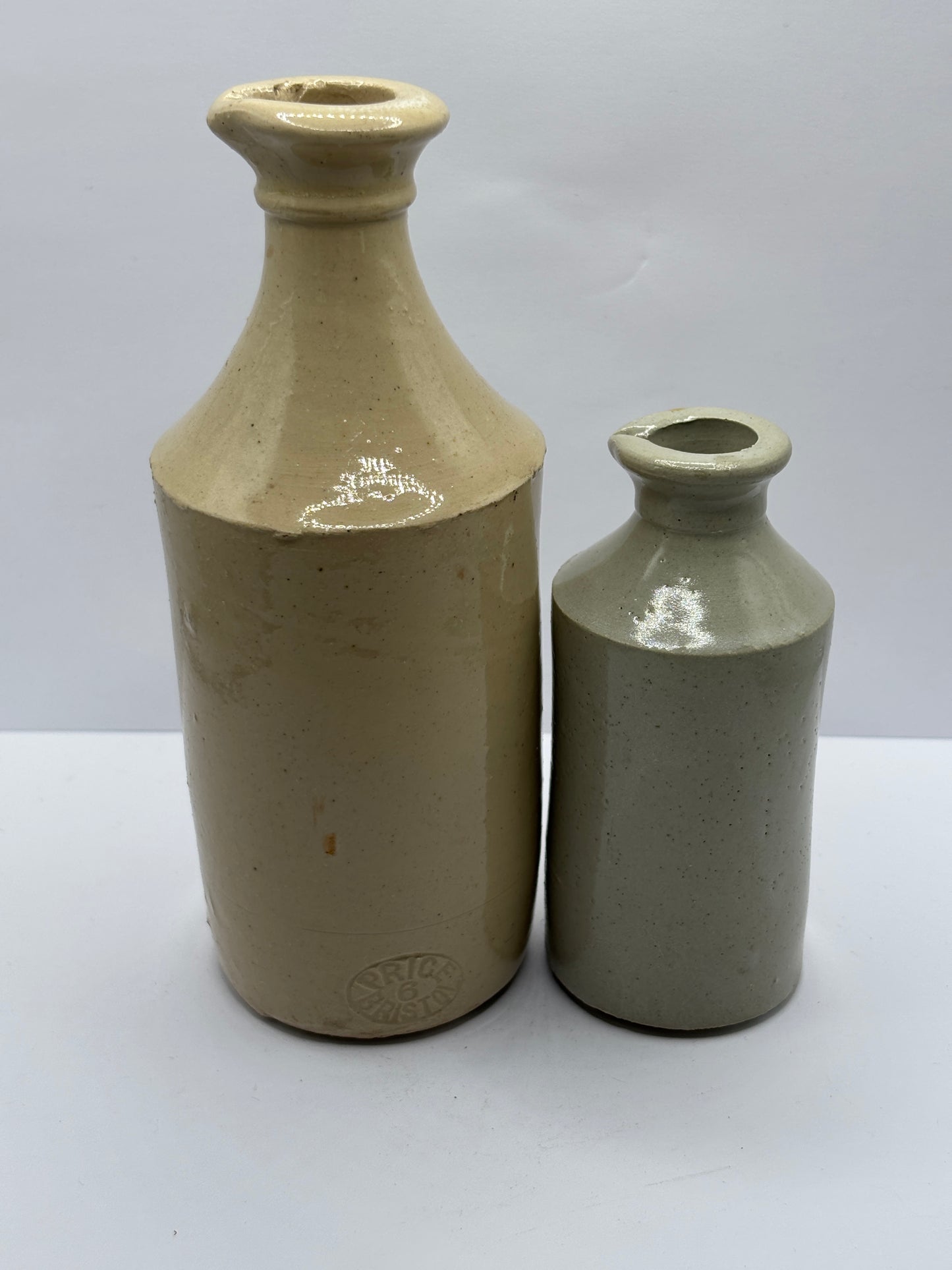 2 old white stoneware pouring ink bottles