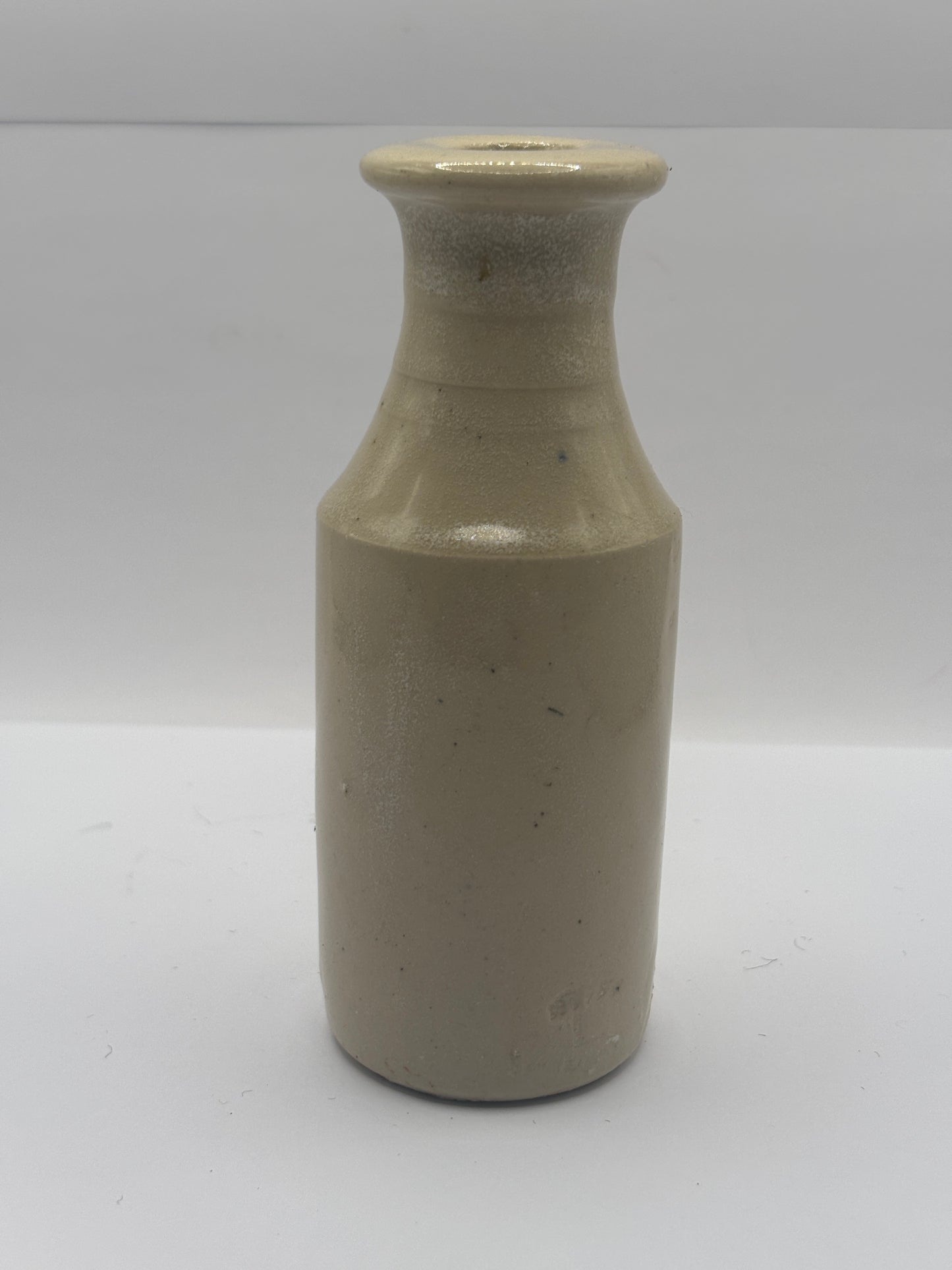 Old tall white stoneware bottle, ink? Polish?