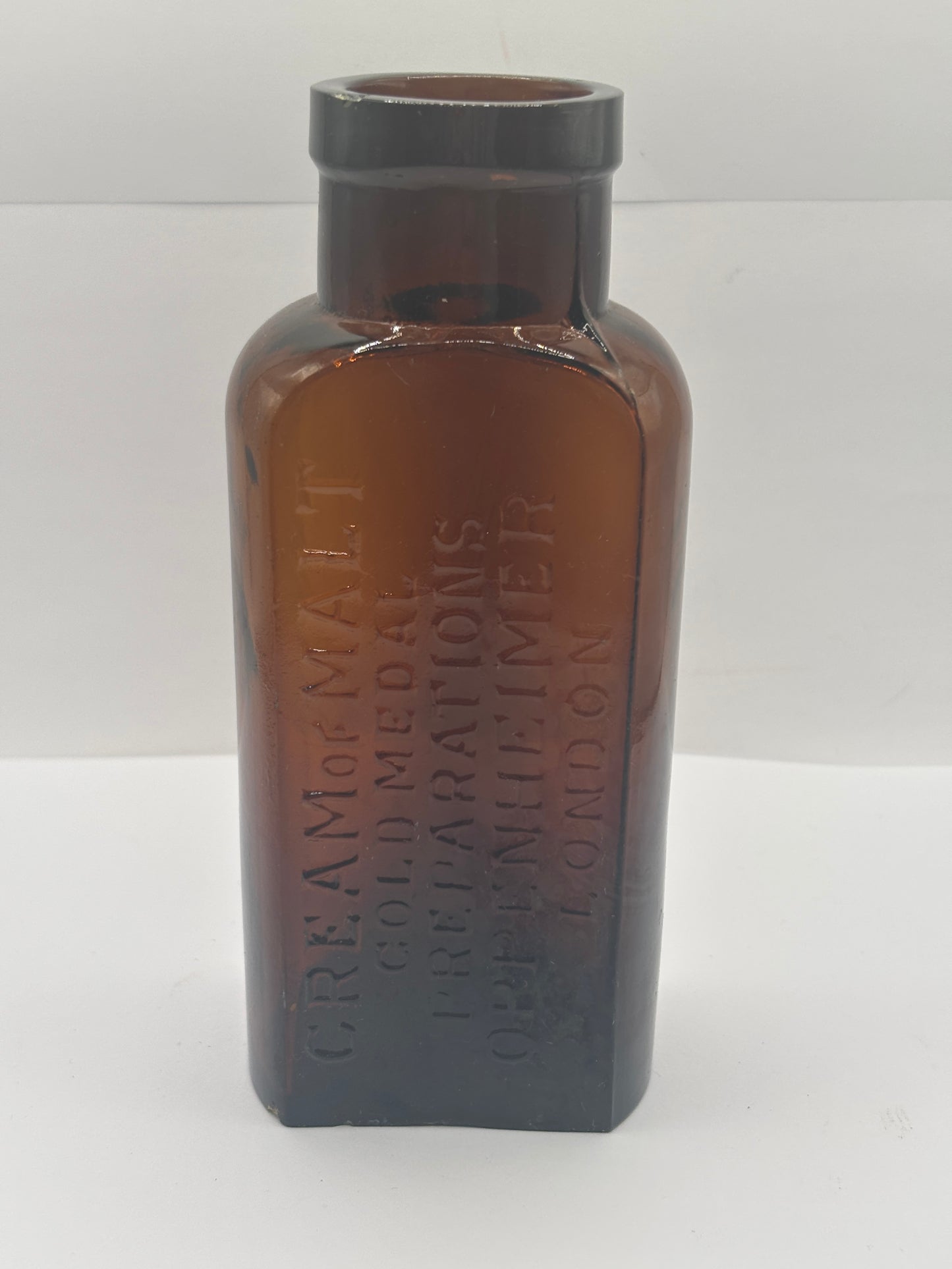 Old amber glass cream of malt bottle