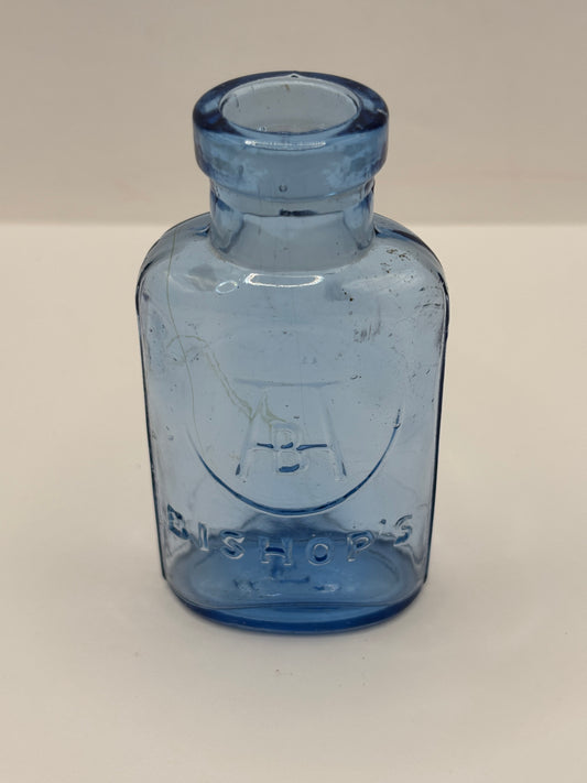 Old small blue glass advertising chemist bottle, Bishop