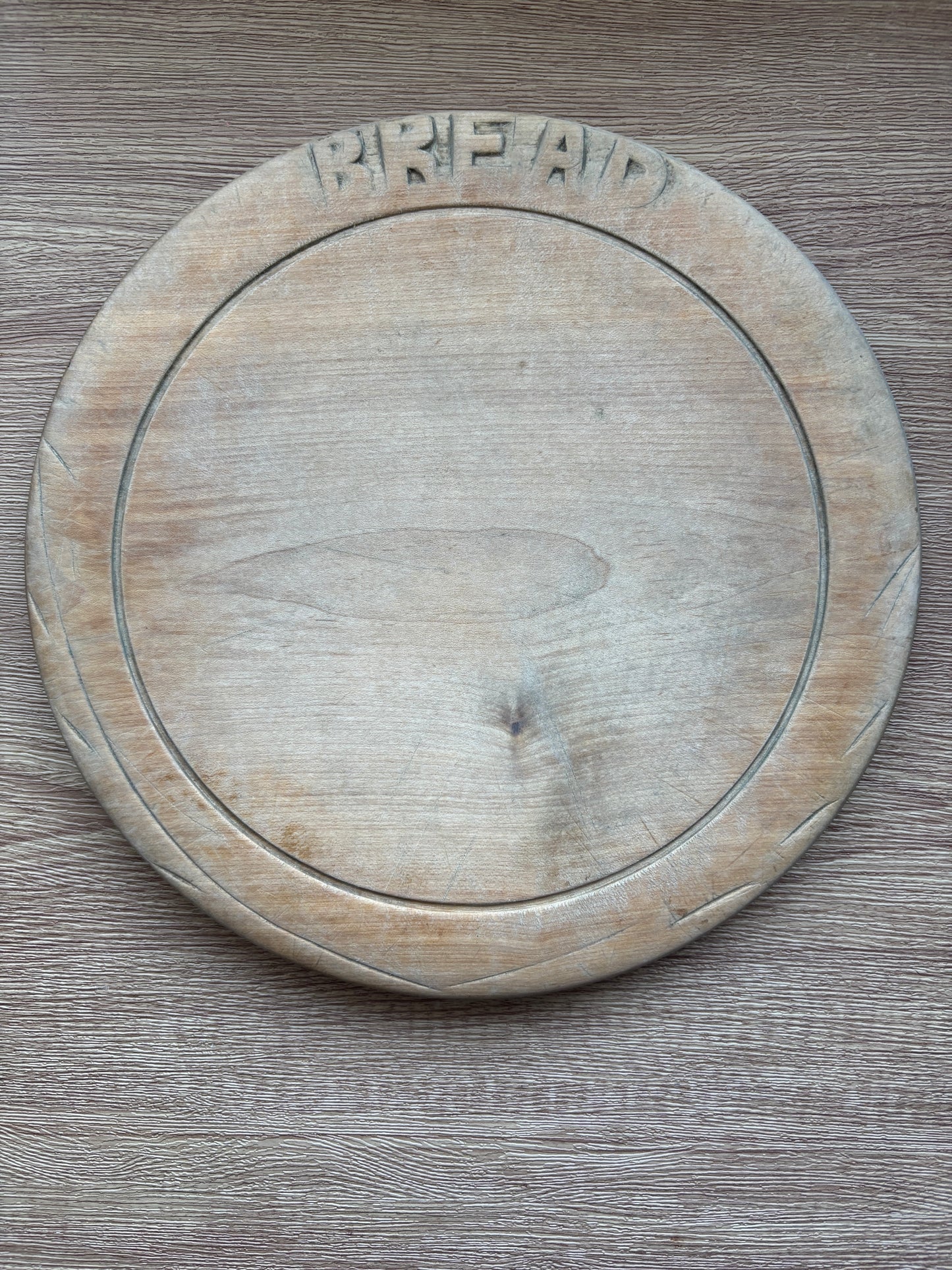 Old wooden carved bread board
