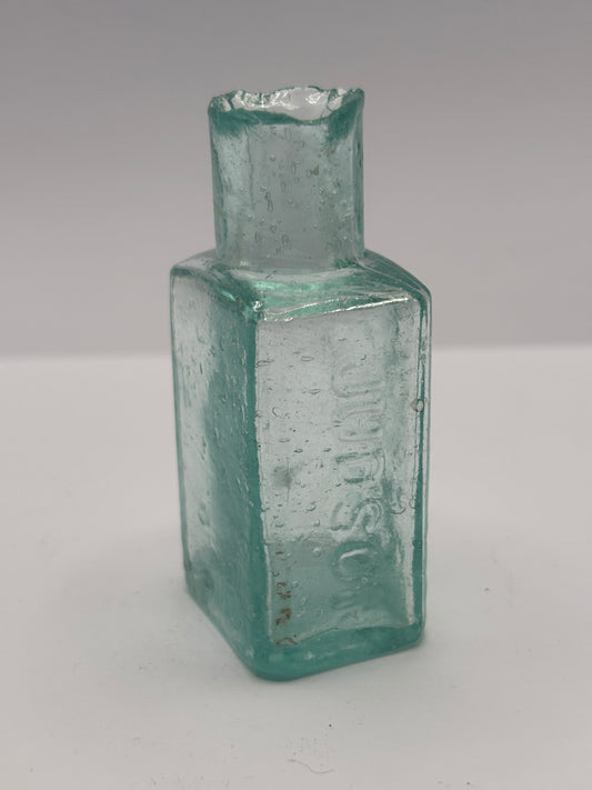 Old aqua glass advertising inkwell. Judson London
