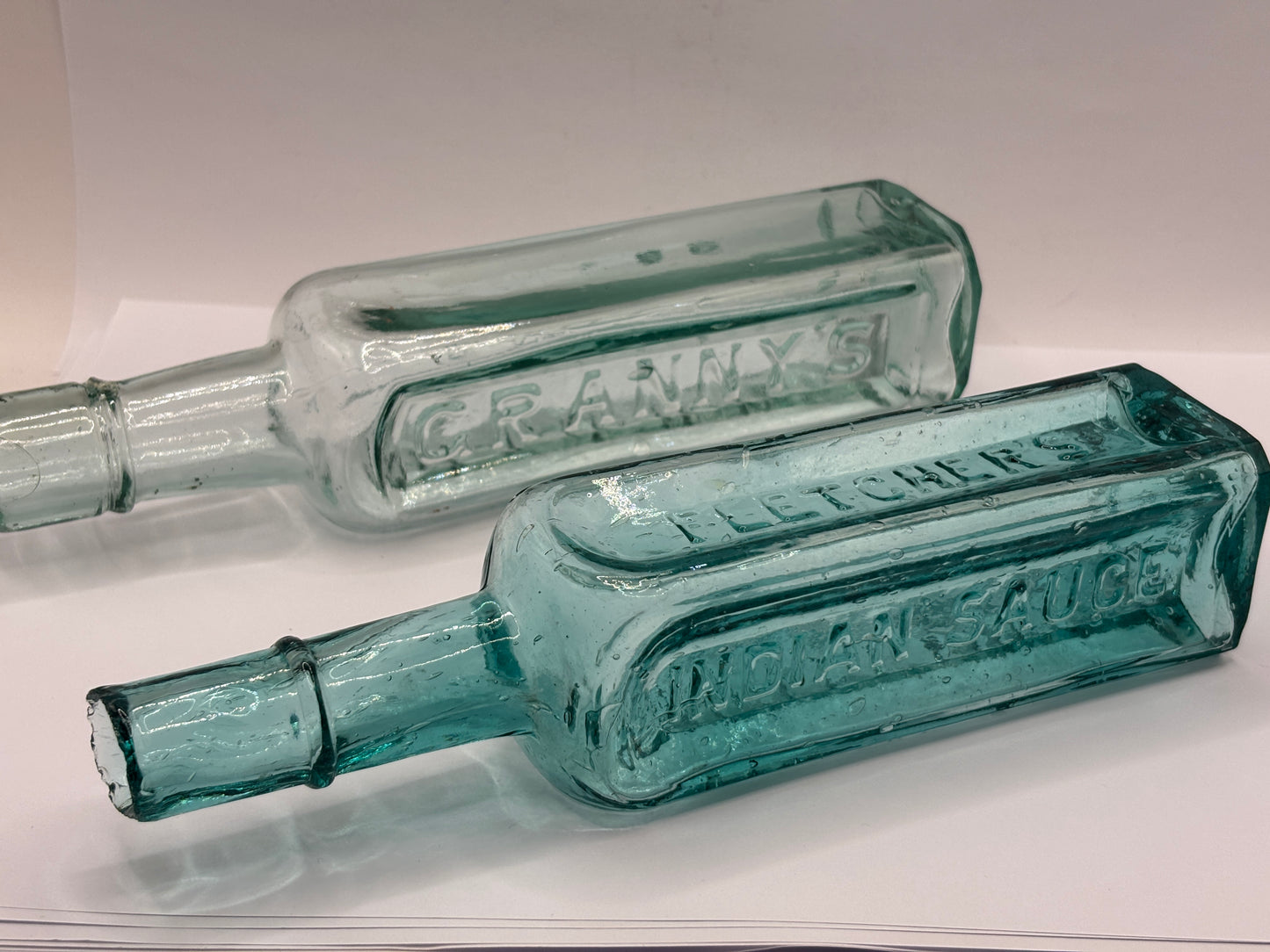 2 old aqua glass sauce bottles, Grannys & indian sauce