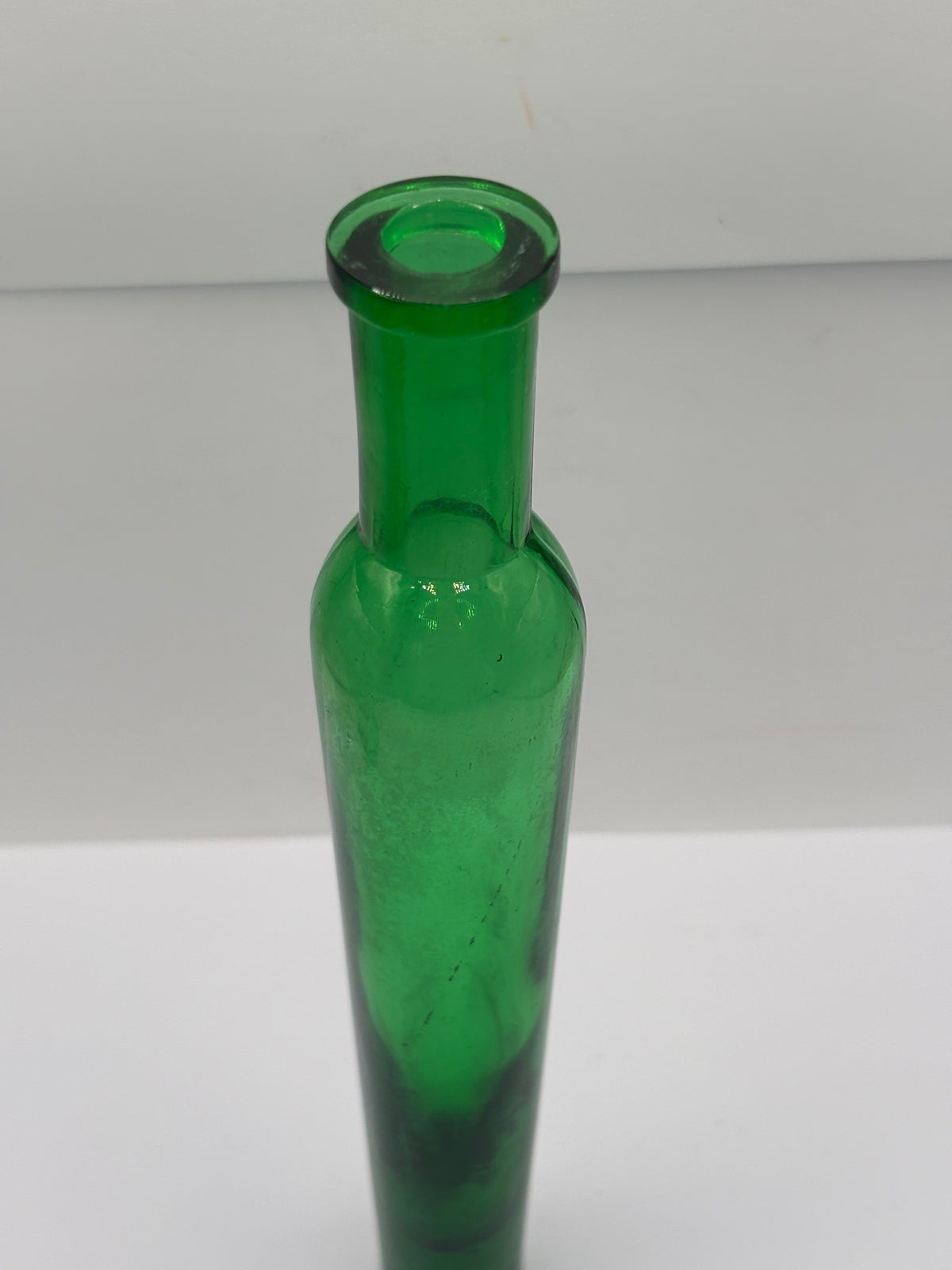 old tall green glass lavender water bottle
