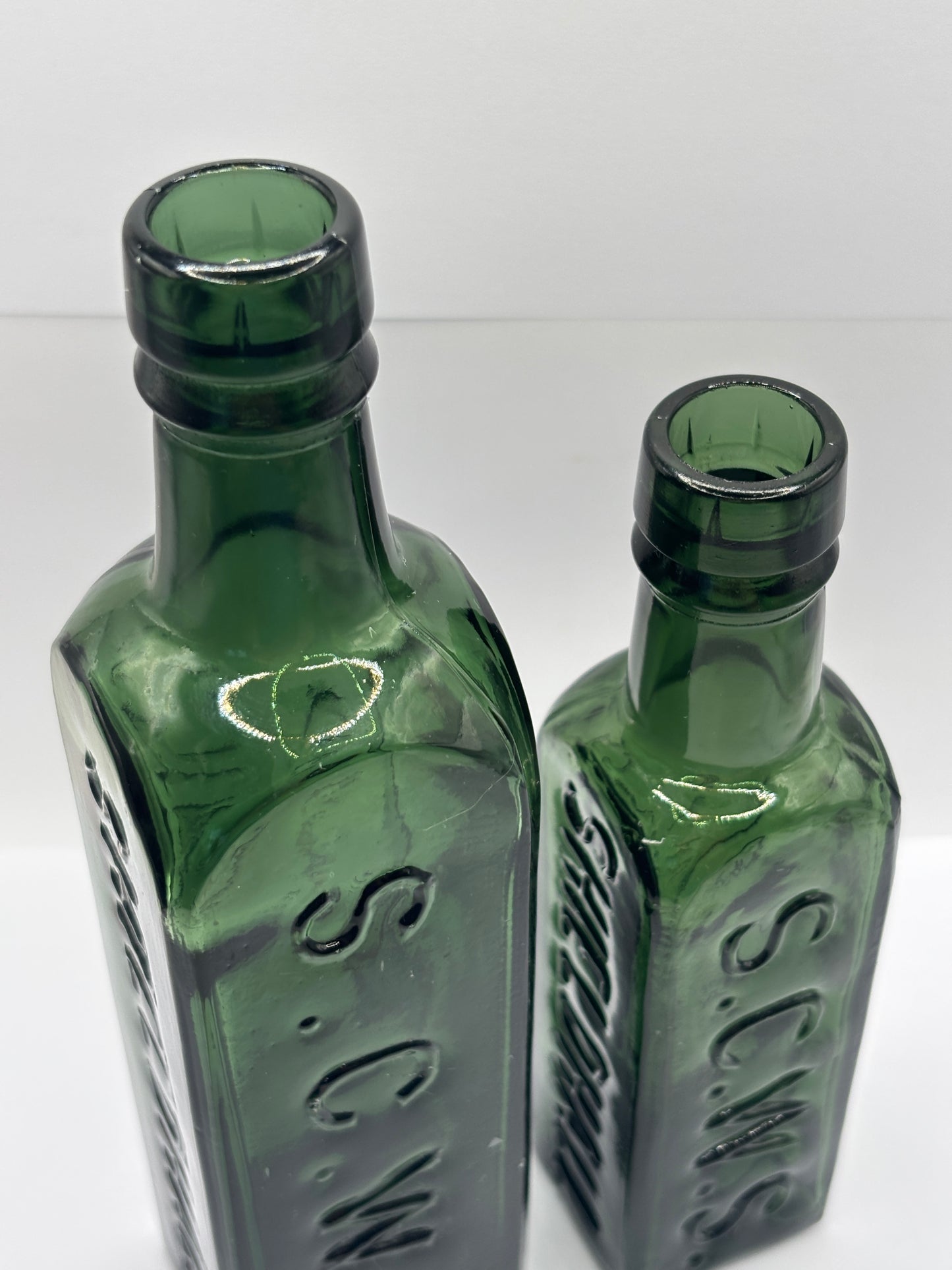 2 old dark green essence of coffee and chicory bottles