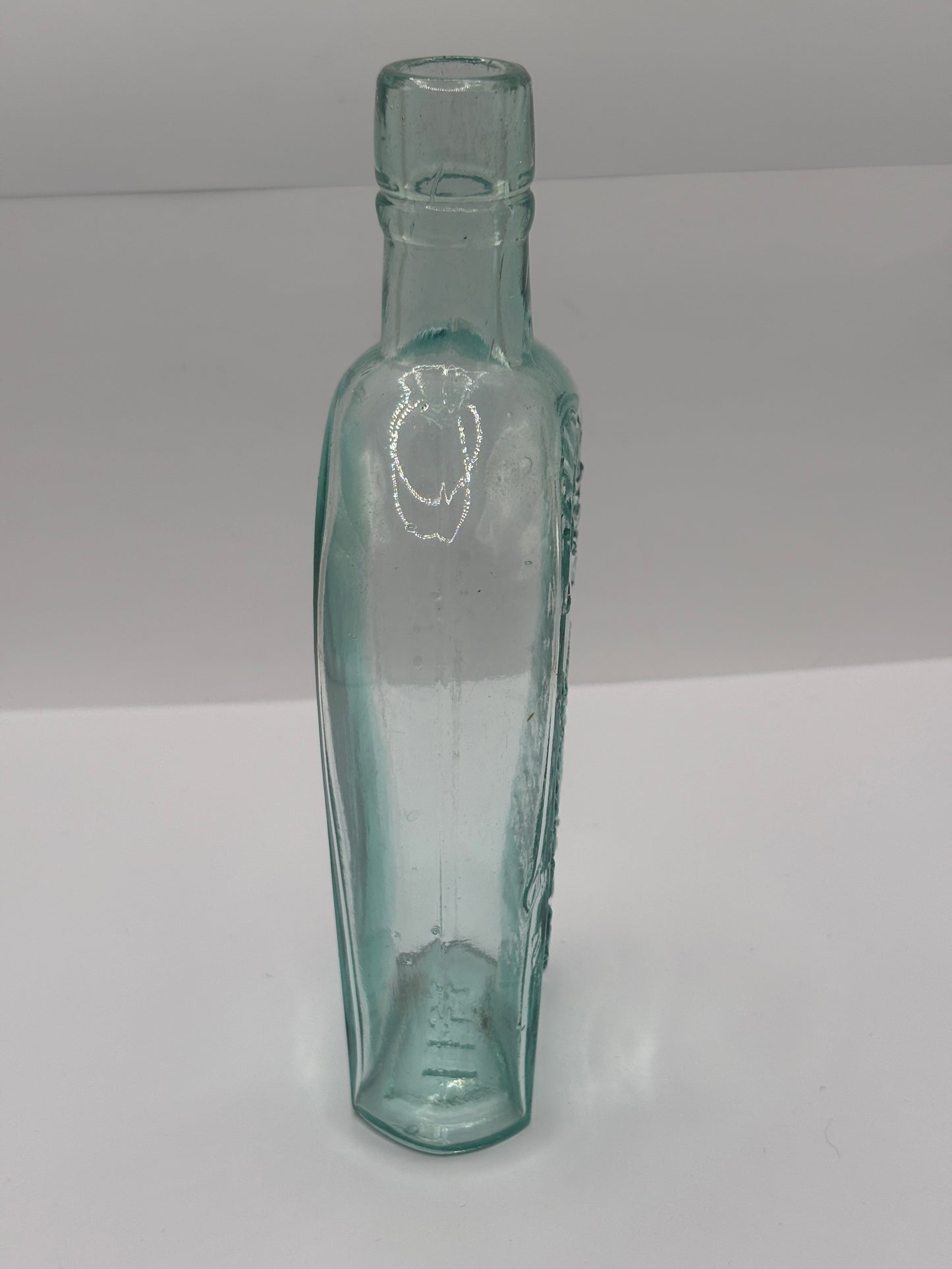 Old glass spirit flask, J.Strickland brewer wine & spirit merchant. Nelson