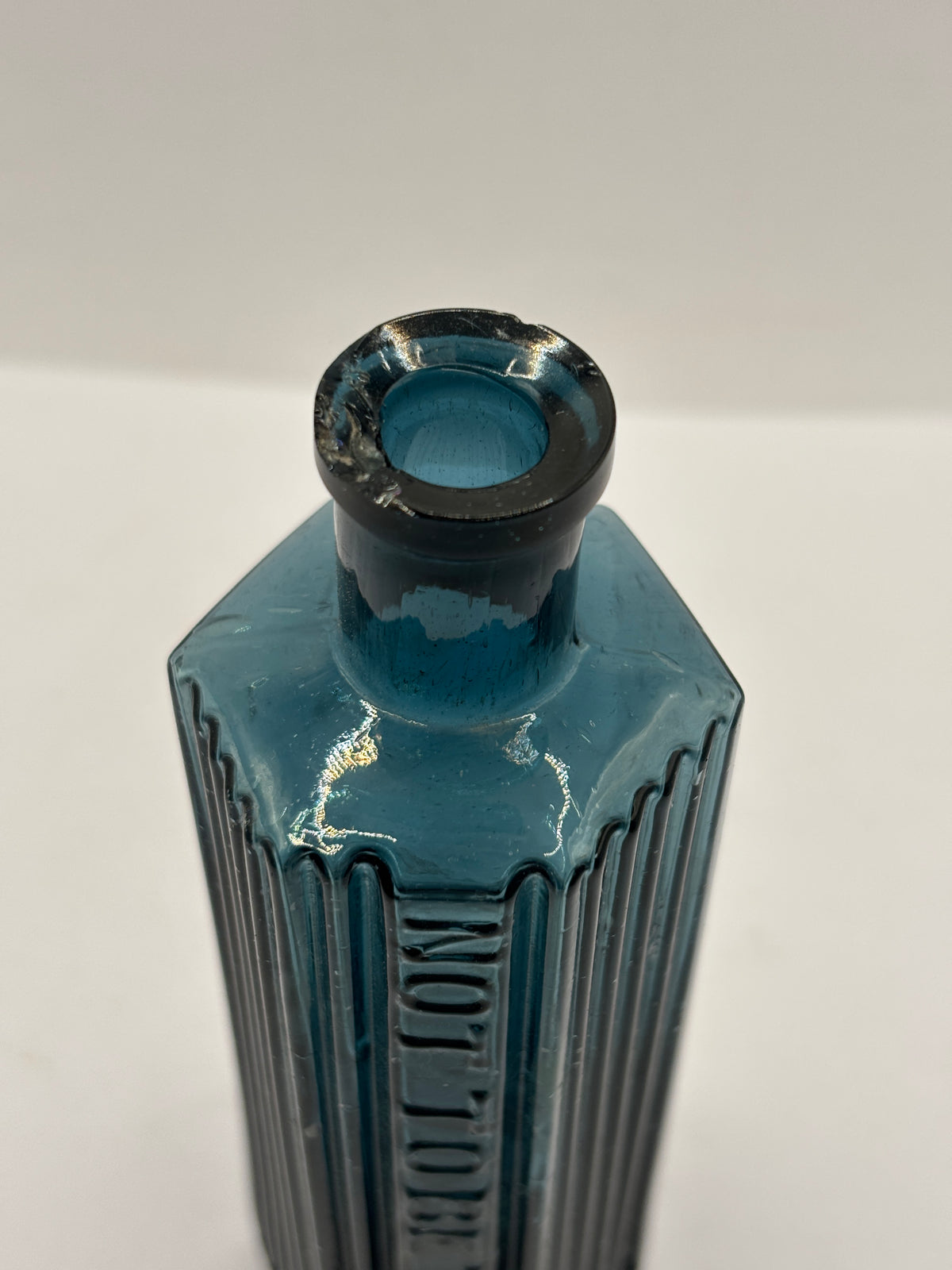 old blue glass ribbed poison bottle, not to be taken. Unusual colour