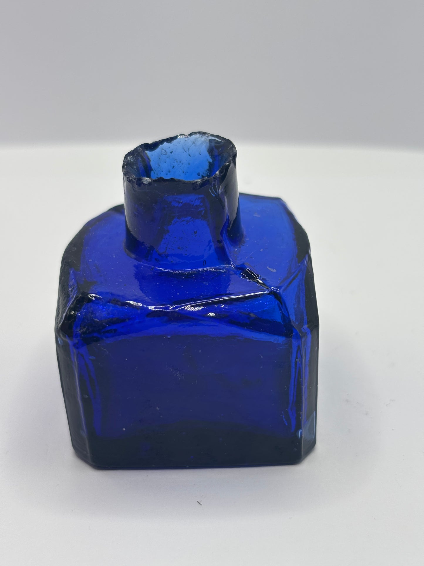 Old cobalt blue glass inkwell, ink bottle