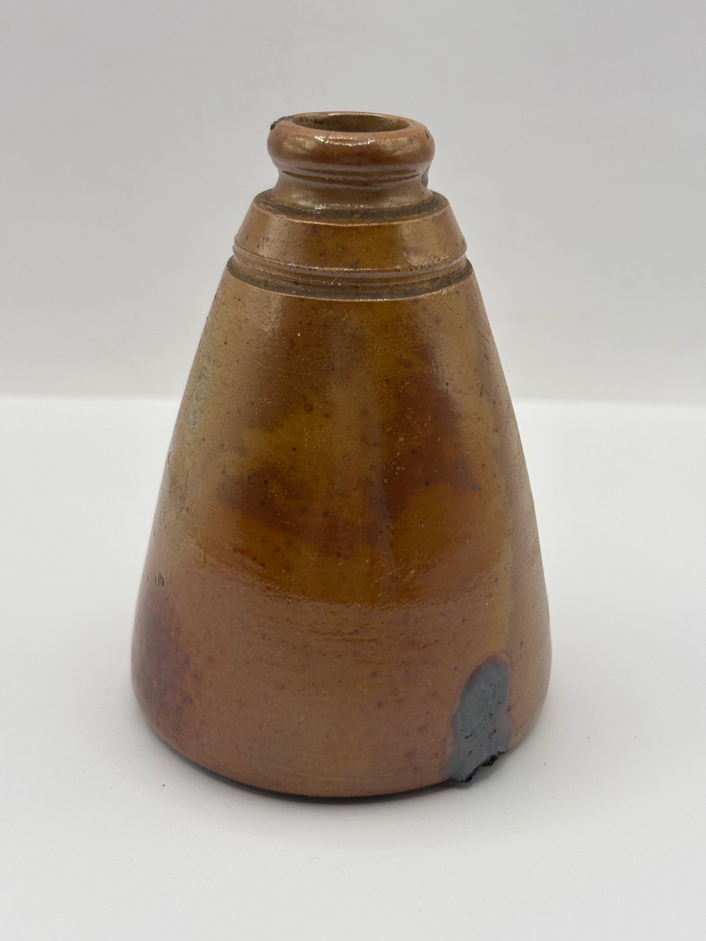 Old brown stoneware inkwell, ink bottle. Cone ink