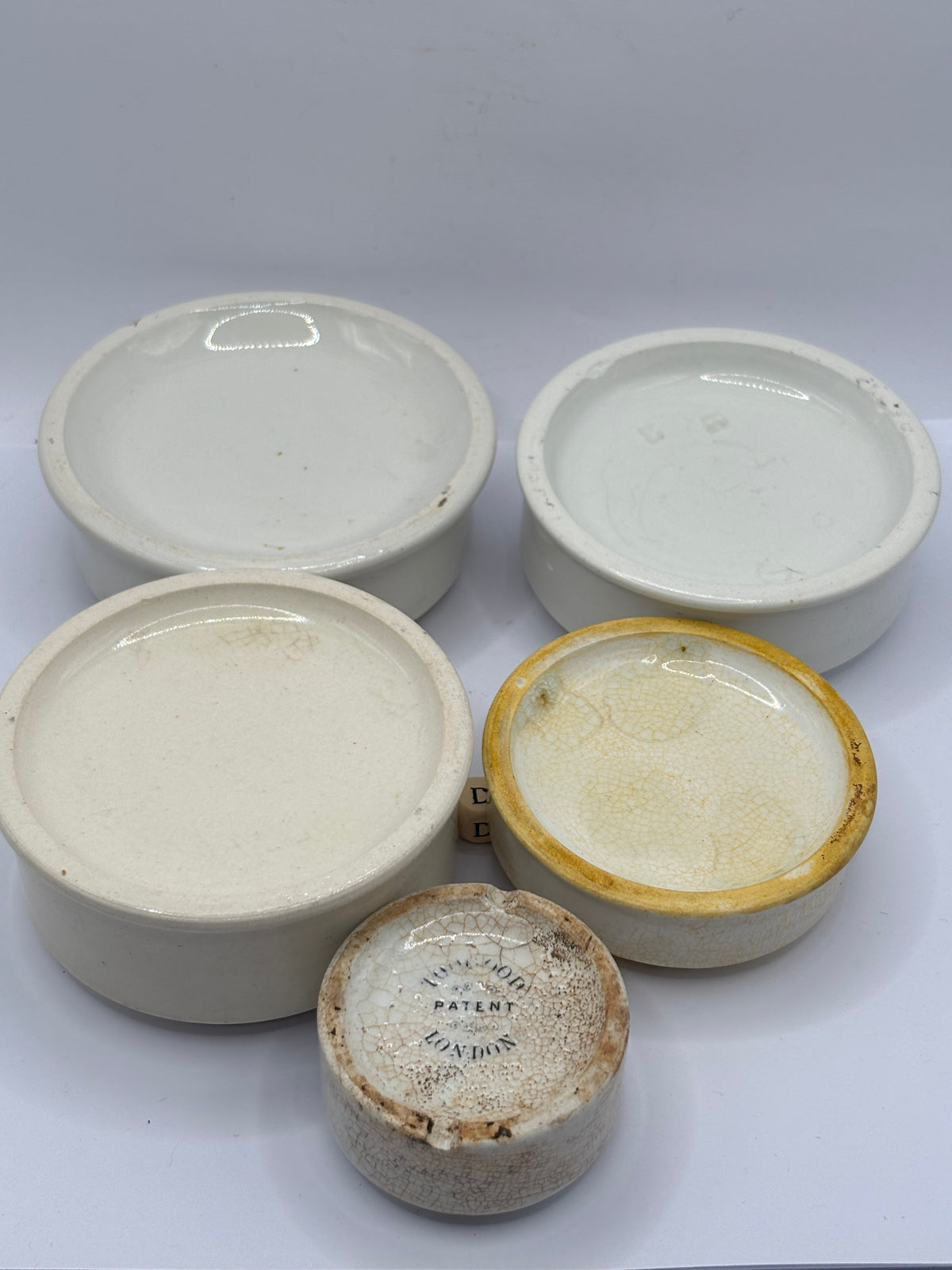 5 old stoneware pot lid bases, stackers (D)