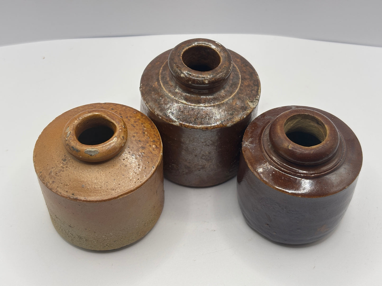 3 old brown stoneware inkwells, ink bottles. Pork pie inks