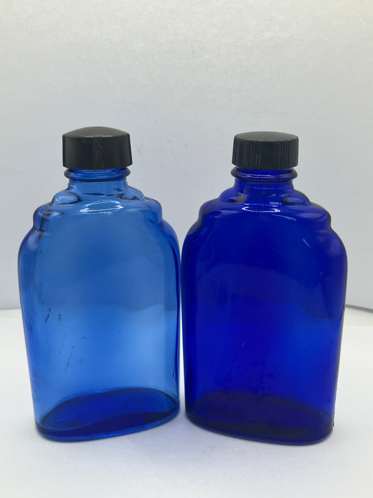 2 blue glass optrex bottles