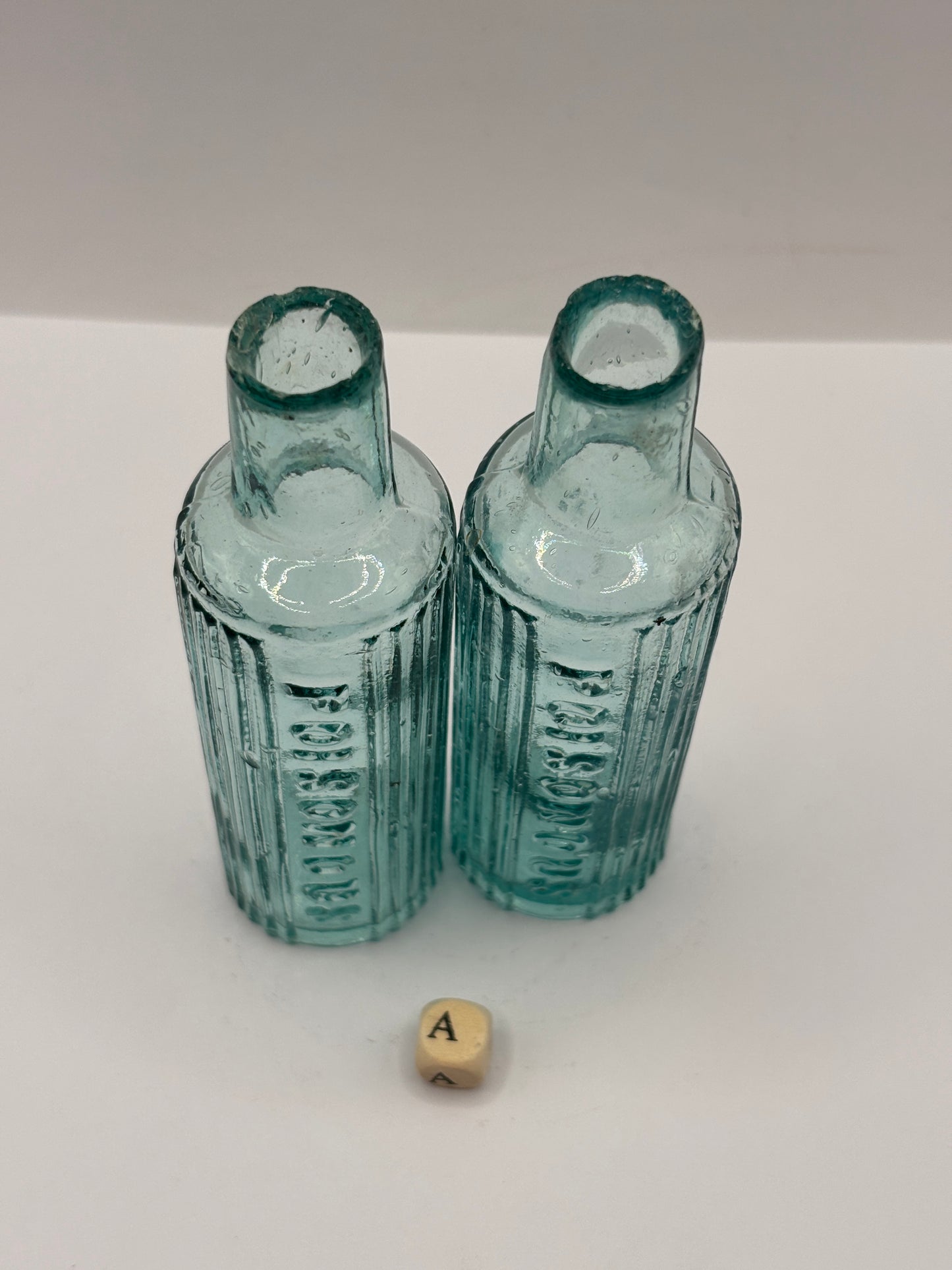 2 old aqua glass poison bottles, POISONOUS (a)