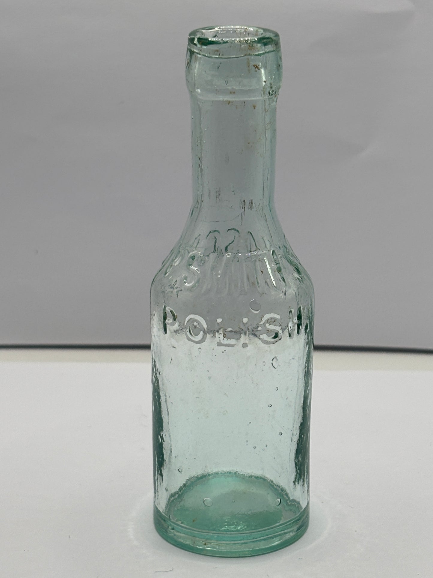 Small aqua glass furniture polish. P.Smiths & sons