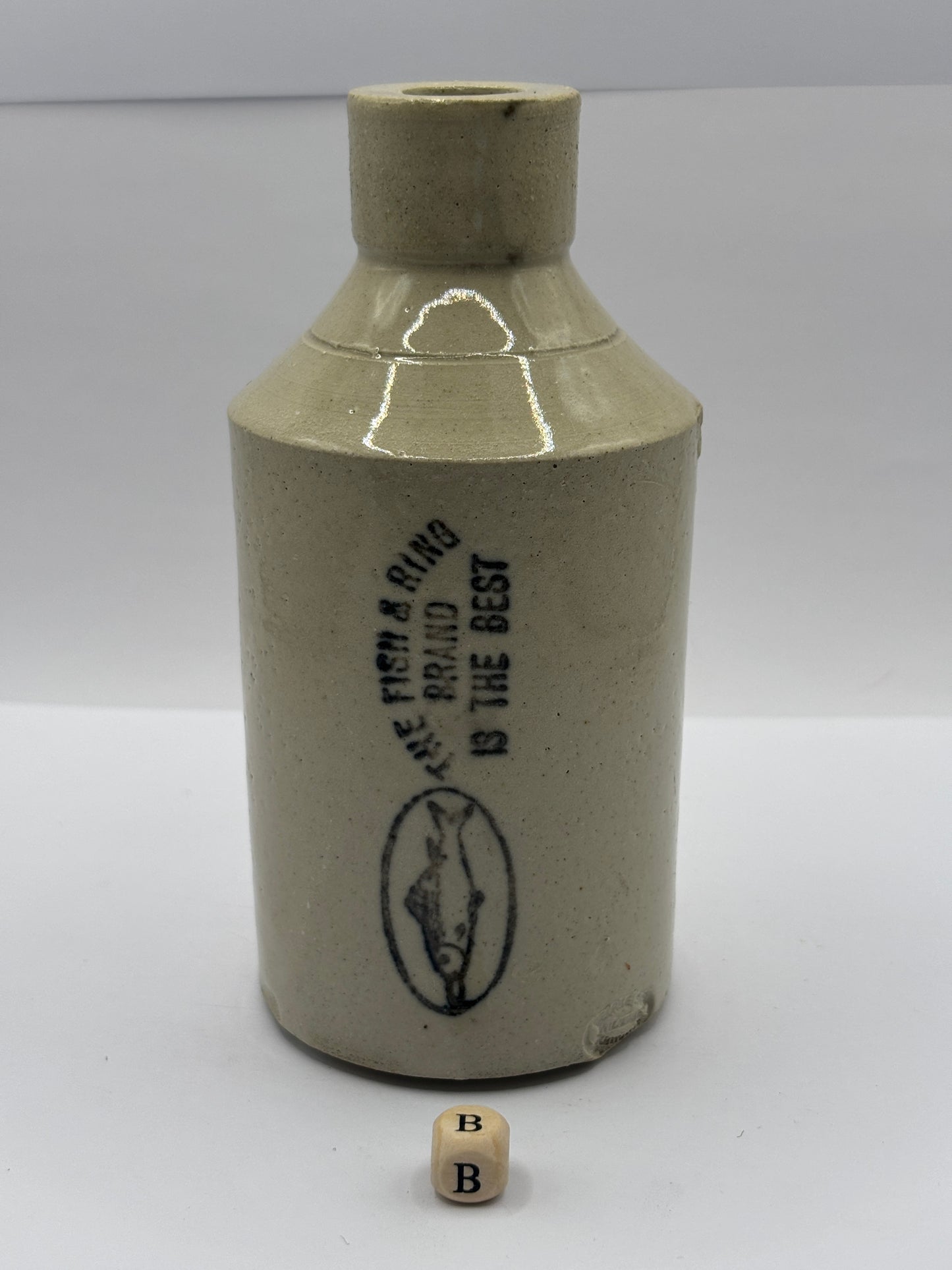 Old stoneware Fish & Ring brand advertising bottle (B)