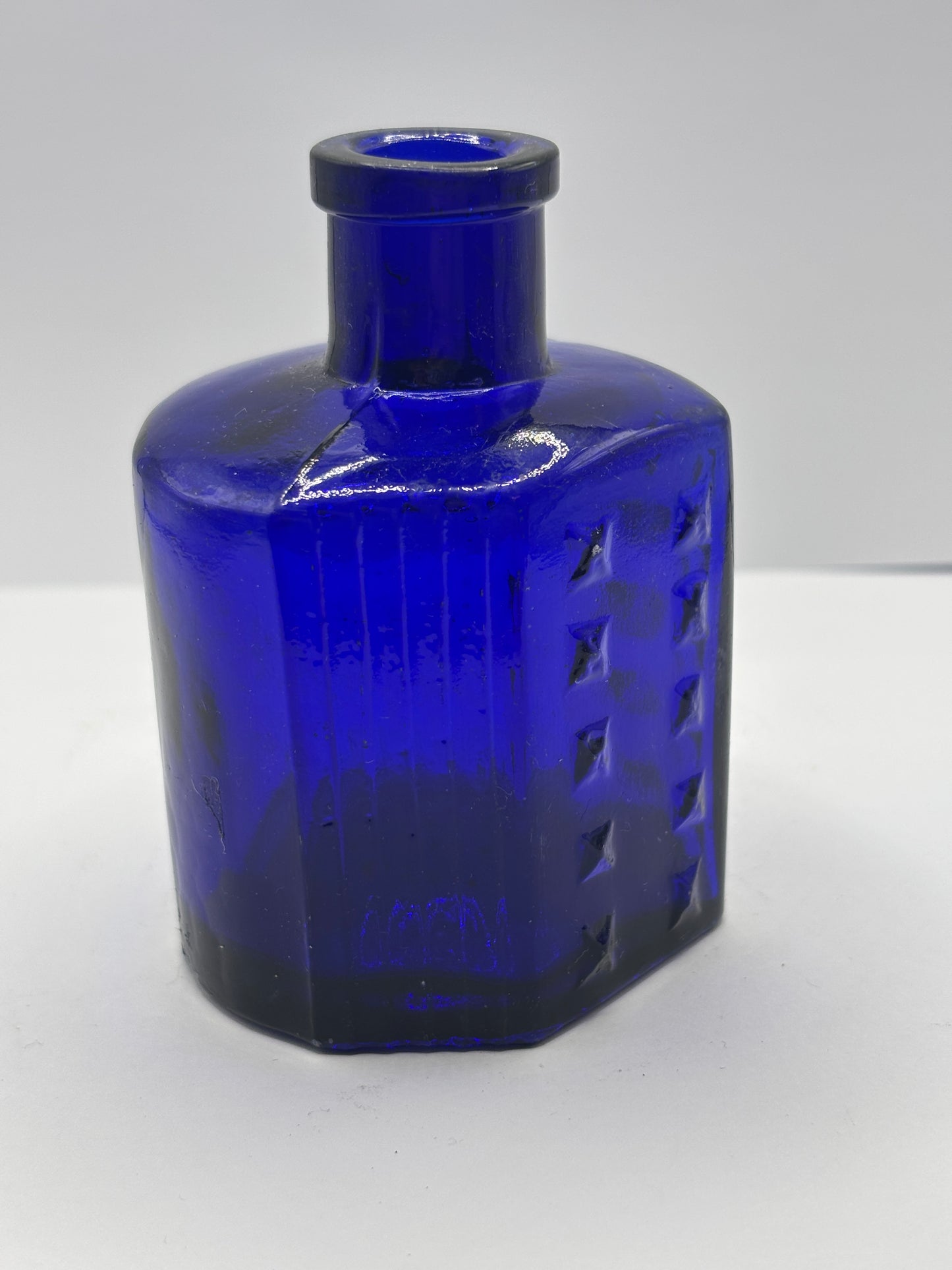 Old blue hobnail poison bottle, chips