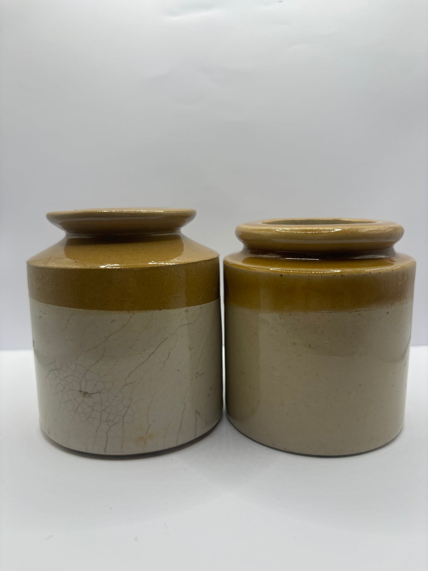 2 small stoneware jars