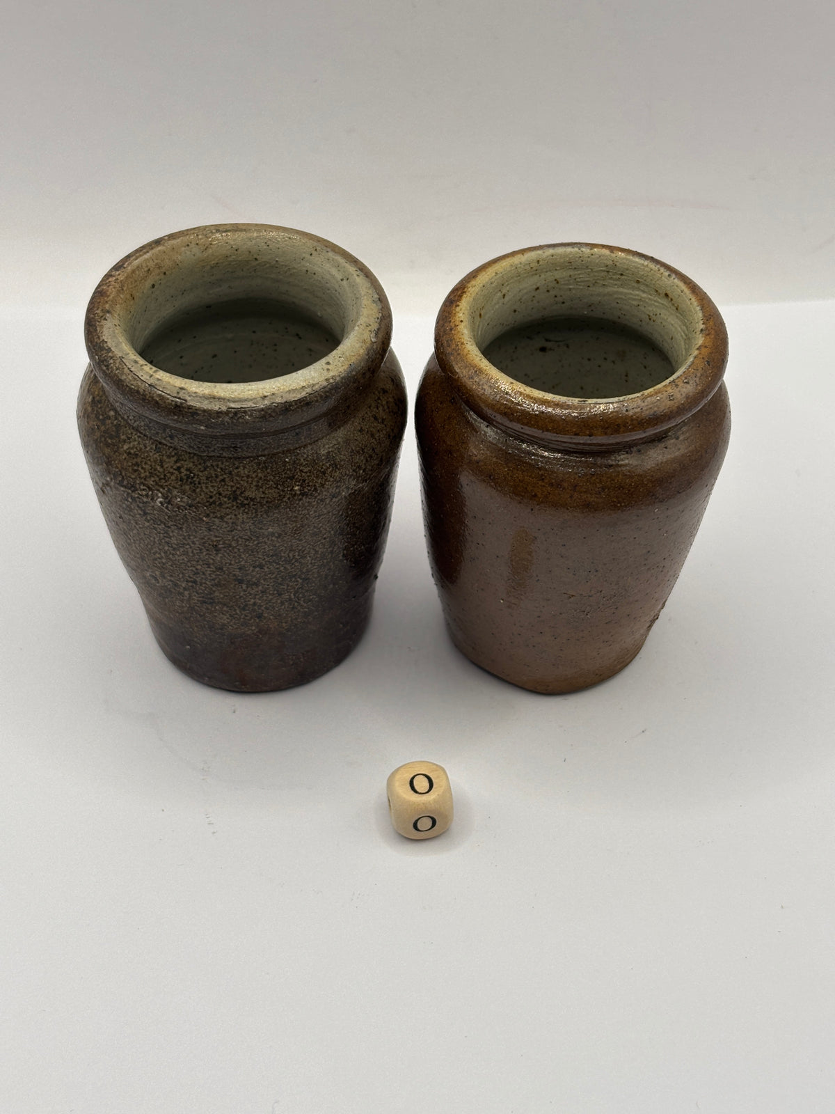 2 Old brown stoneware cream pots (o)