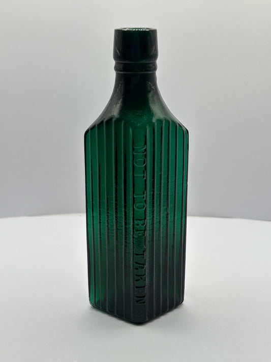 Old green glass poison bottle, not to be taken