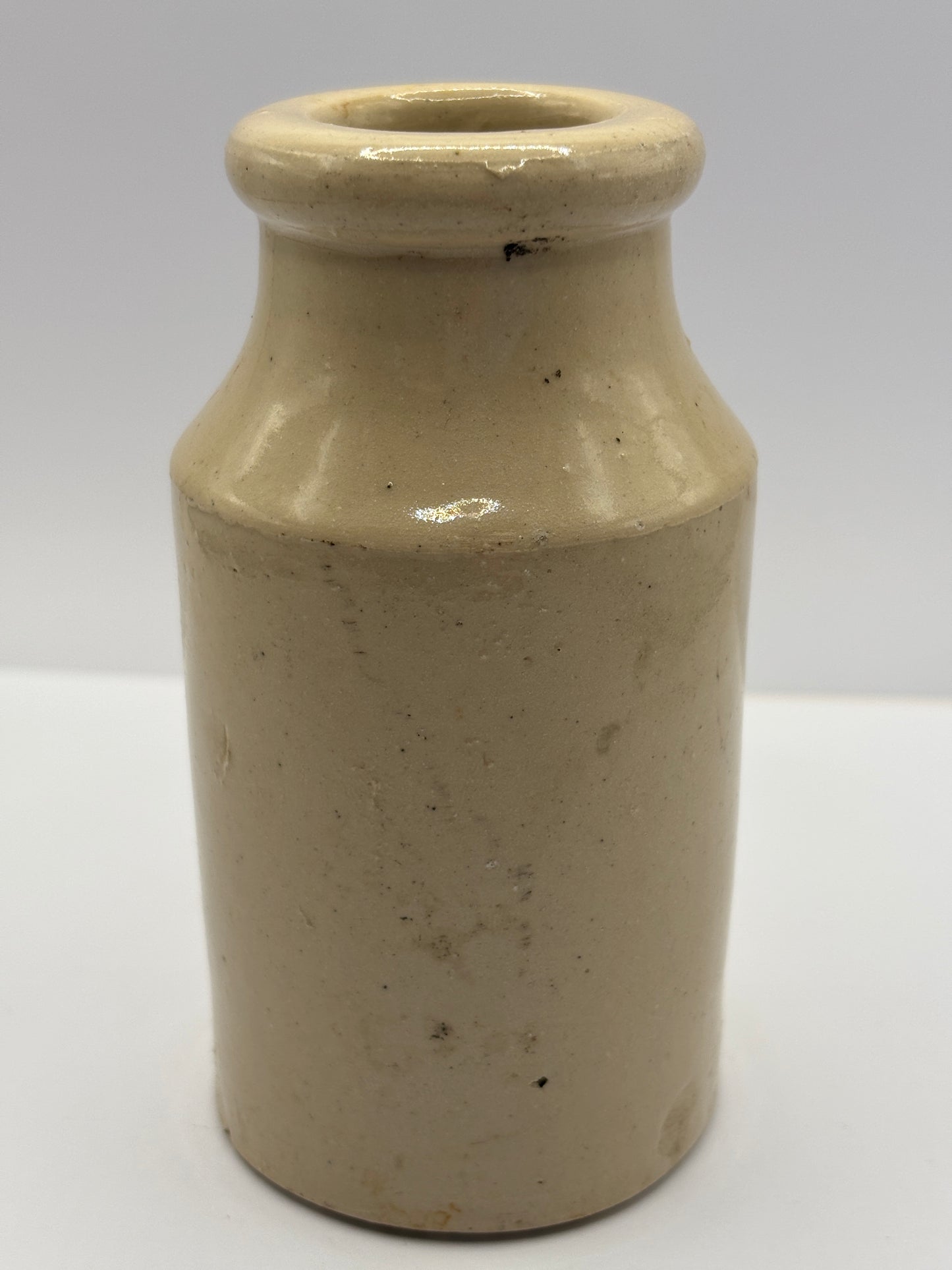Old white stoneware jar, small vase