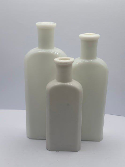 3 old white milk glass bottles
