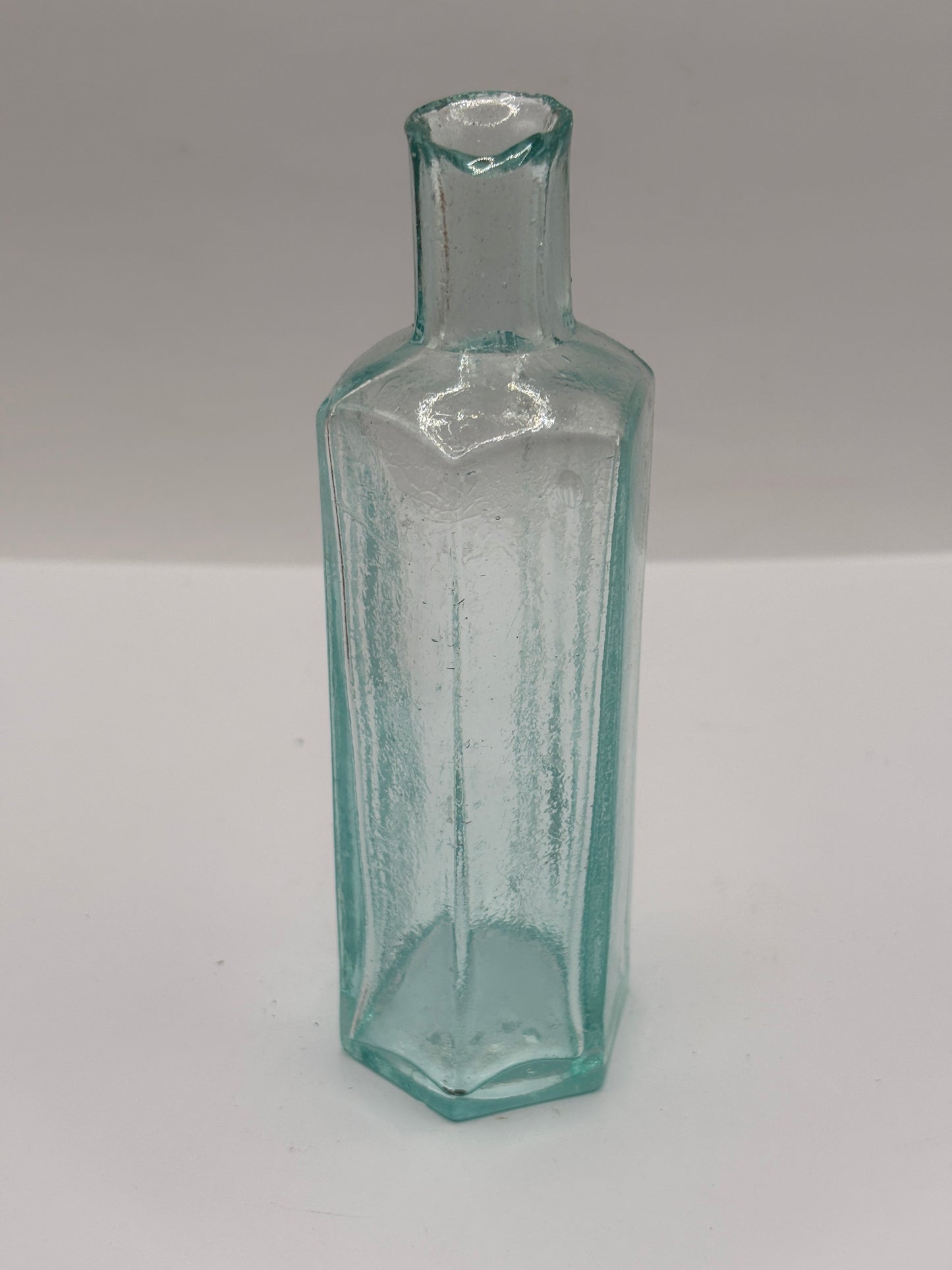 Old aqua glass poison bottle, not to be taken