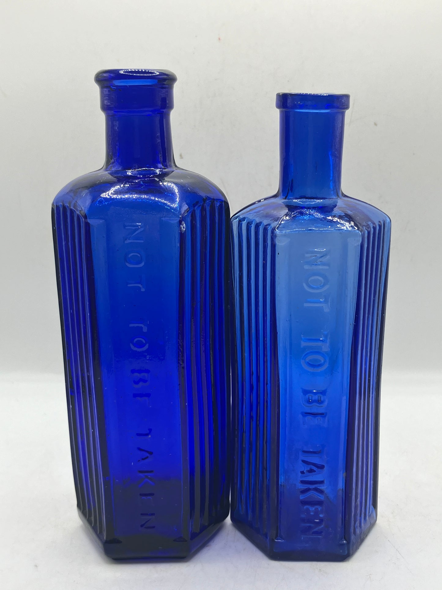 2 blue glass ribbed poison bottles, Not to be taken