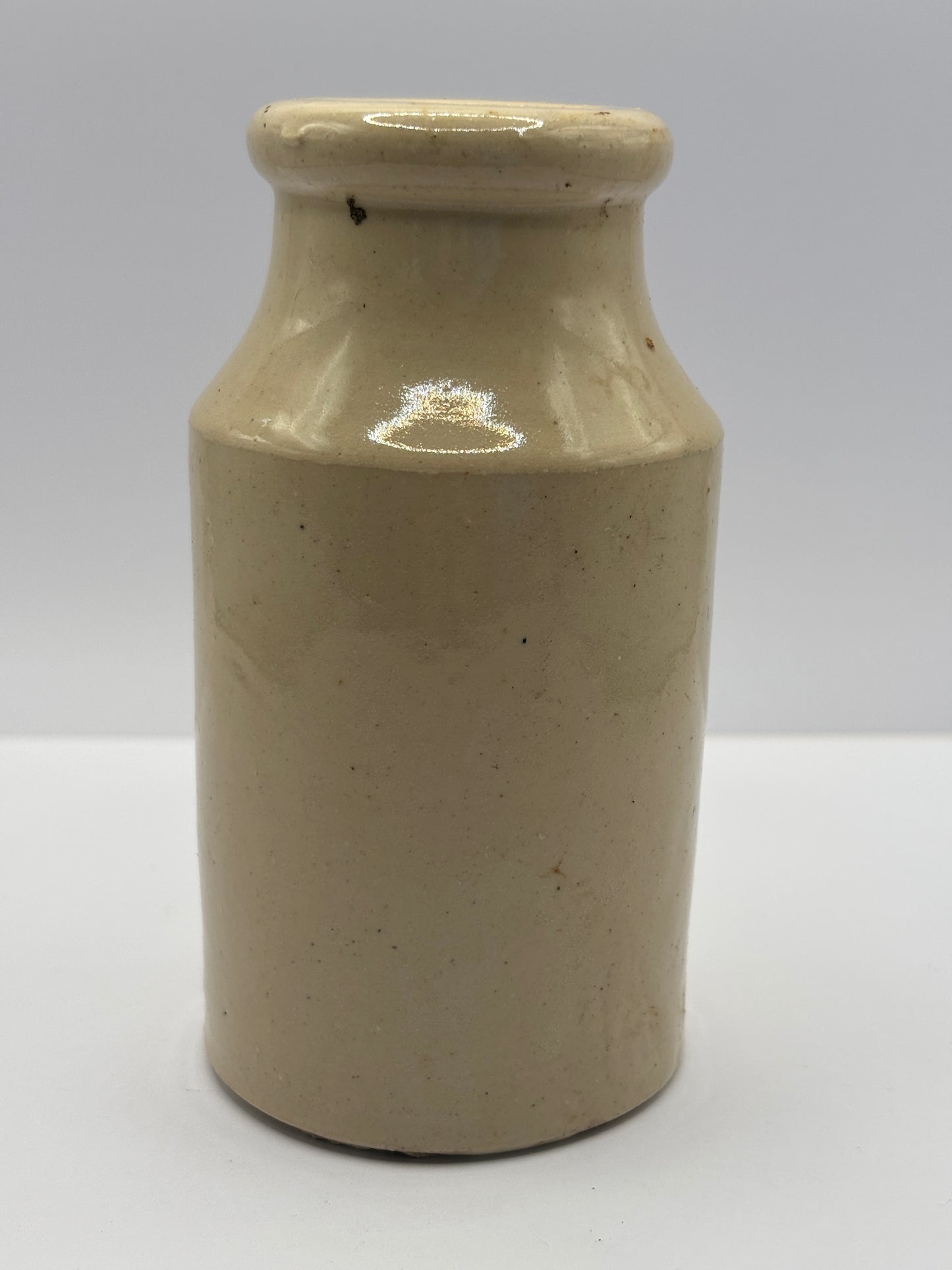 Old white stoneware jar, small vase